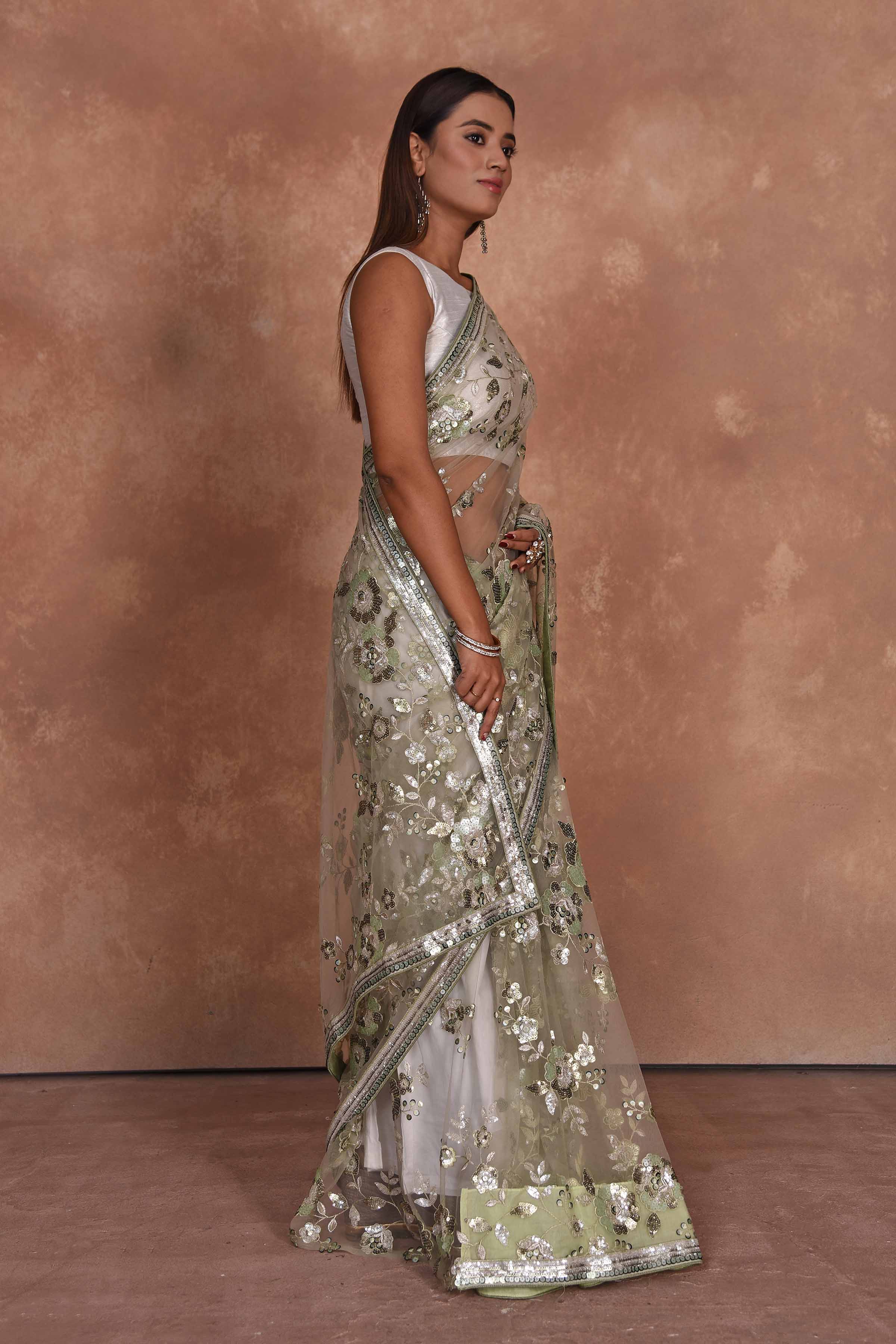 Shop beautiful beige heavy embroidery net saree online in USA. Keep your ethnic wardrobe up to date with latest designer sarees, pure silk saris, Kanchipuram silk sarees, handwoven sarees, tussar silk saris, embroidered sarees, soft silk sarees from Pure Elegance Indian saree store in USA.-side