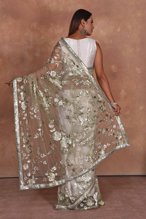 Shop beautiful beige heavy embroidery net saree online in USA. Keep your ethnic wardrobe up to date with latest designer sarees, pure silk saris, Kanchipuram silk sarees, handwoven sarees, tussar silk saris, embroidered sarees, soft silk sarees from Pure Elegance Indian saree store in USA.-back