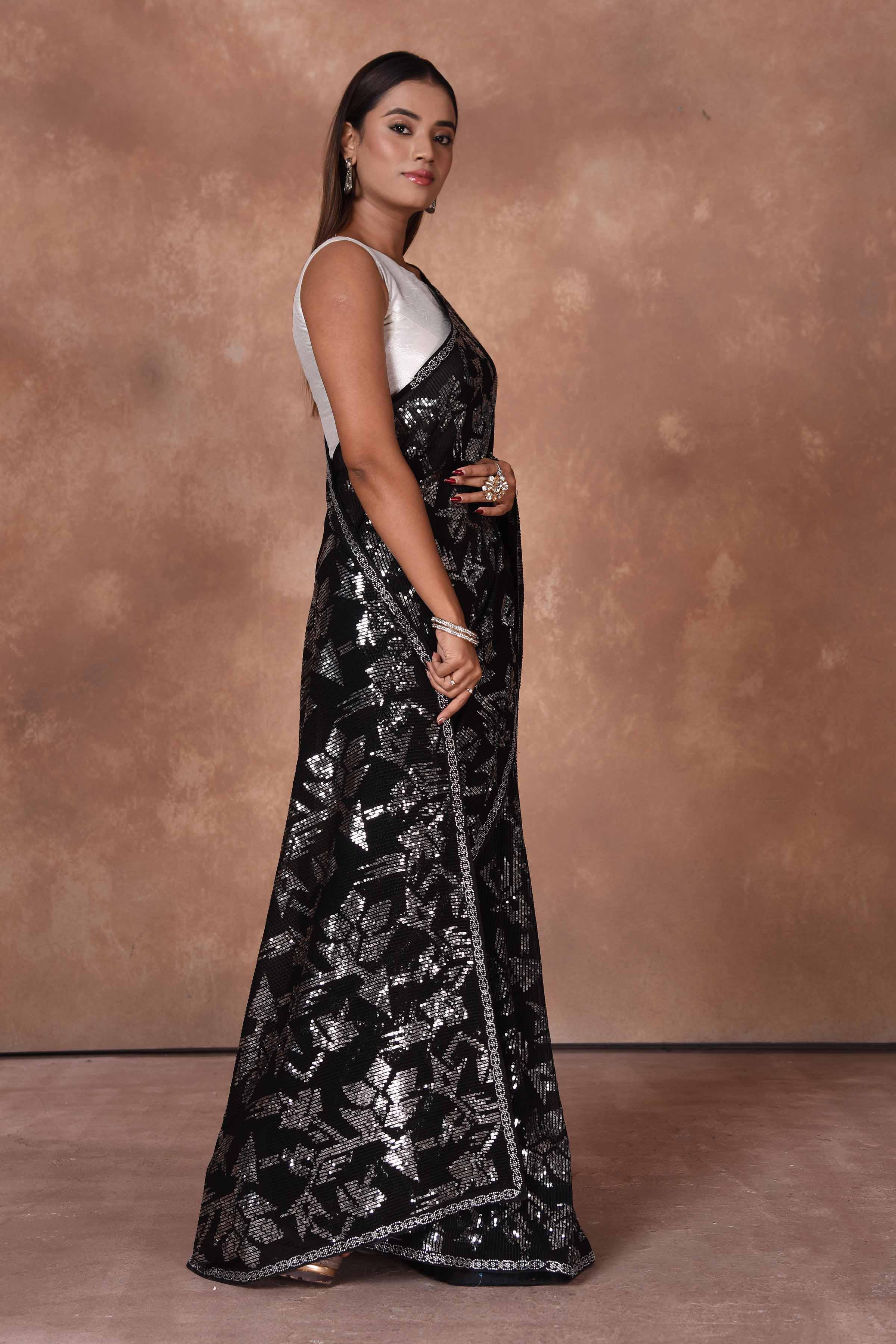 Shop stunning black and silver sequin work saree online in USA. Keep your ethnic wardrobe up to date with latest designer sarees, pure silk saris, Kanchipuram silk sarees, handwoven sarees, tussar silk saris, embroidered sarees, soft silk sarees from Pure Elegance Indian saree store in USA.-side