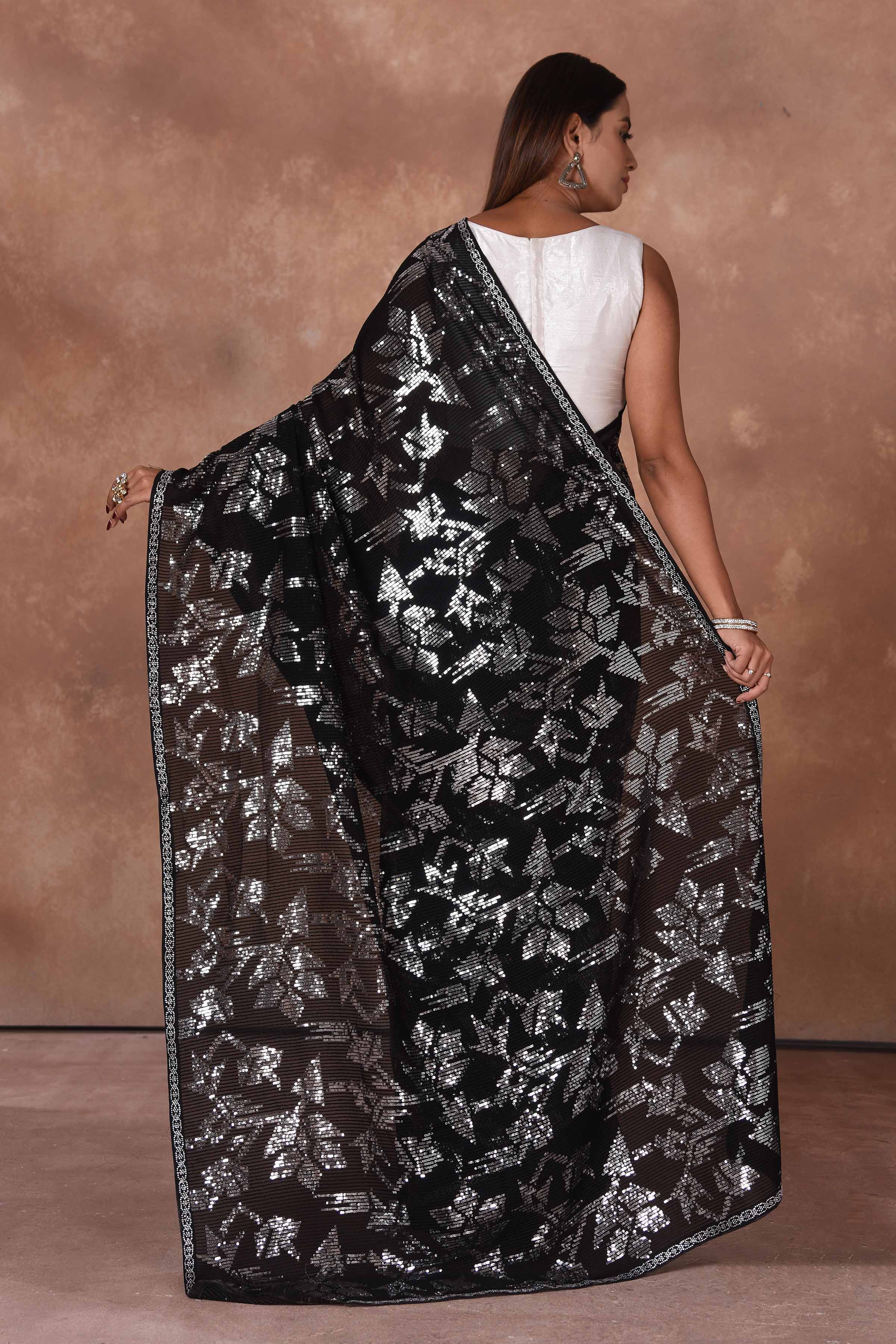 Shop stunning black and silver sequin work saree online in USA. Keep your ethnic wardrobe up to date with latest designer sarees, pure silk saris, Kanchipuram silk sarees, handwoven sarees, tussar silk saris, embroidered sarees, soft silk sarees from Pure Elegance Indian saree store in USA.-back