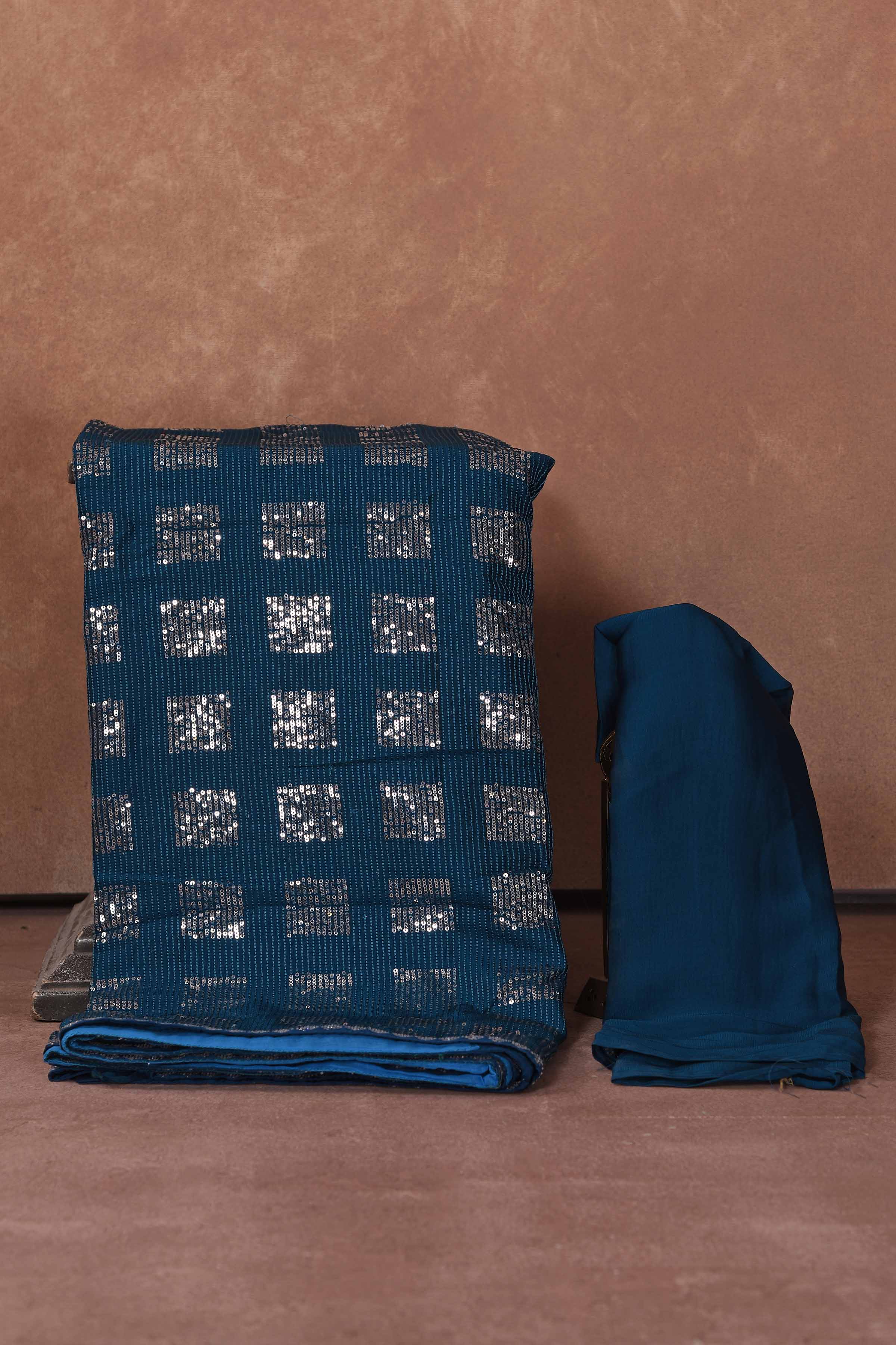 Buy blue and silver sequin work saree online in USA. Keep your ethnic wardrobe up to date with latest designer sarees, pure silk saris, Kanchipuram silk sarees, handwoven sarees, tussar silk saris, embroidered sarees, soft silk sarees from Pure Elegance Indian saree store in USA.-blouse
