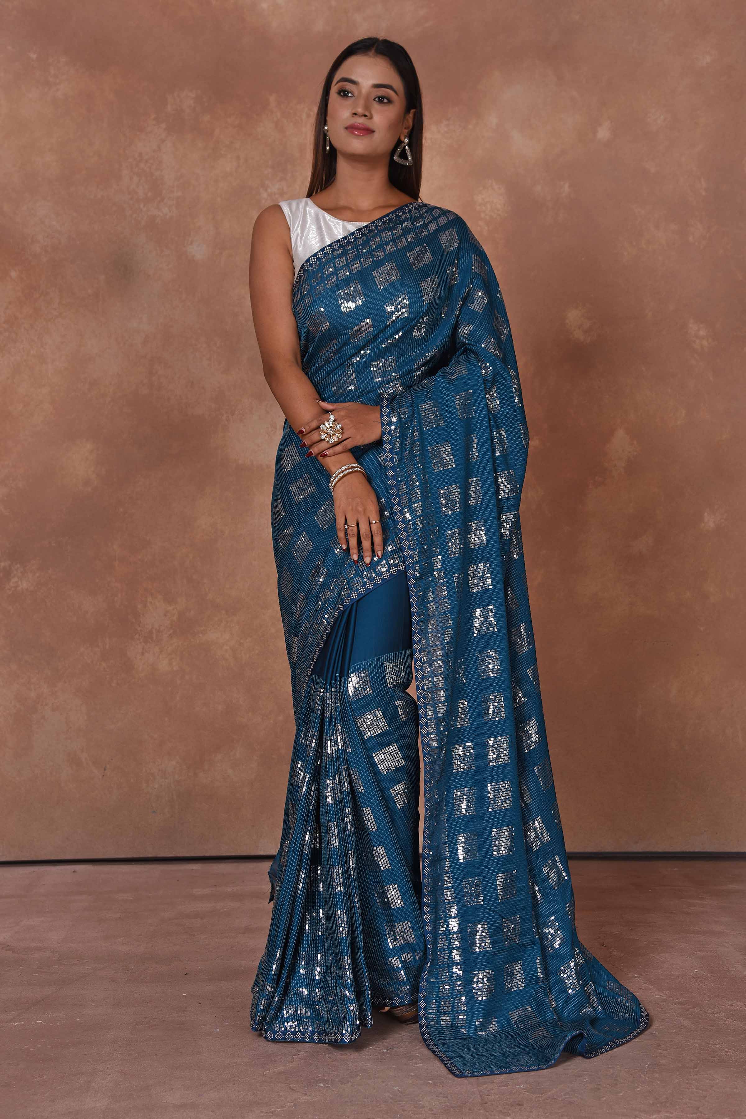 Buy blue and silver sequin work saree online in USA. Keep your ethnic wardrobe up to date with latest designer sarees, pure silk saris, Kanchipuram silk sarees, handwoven sarees, tussar silk saris, embroidered sarees, soft silk sarees from Pure Elegance Indian saree store in USA.-full view