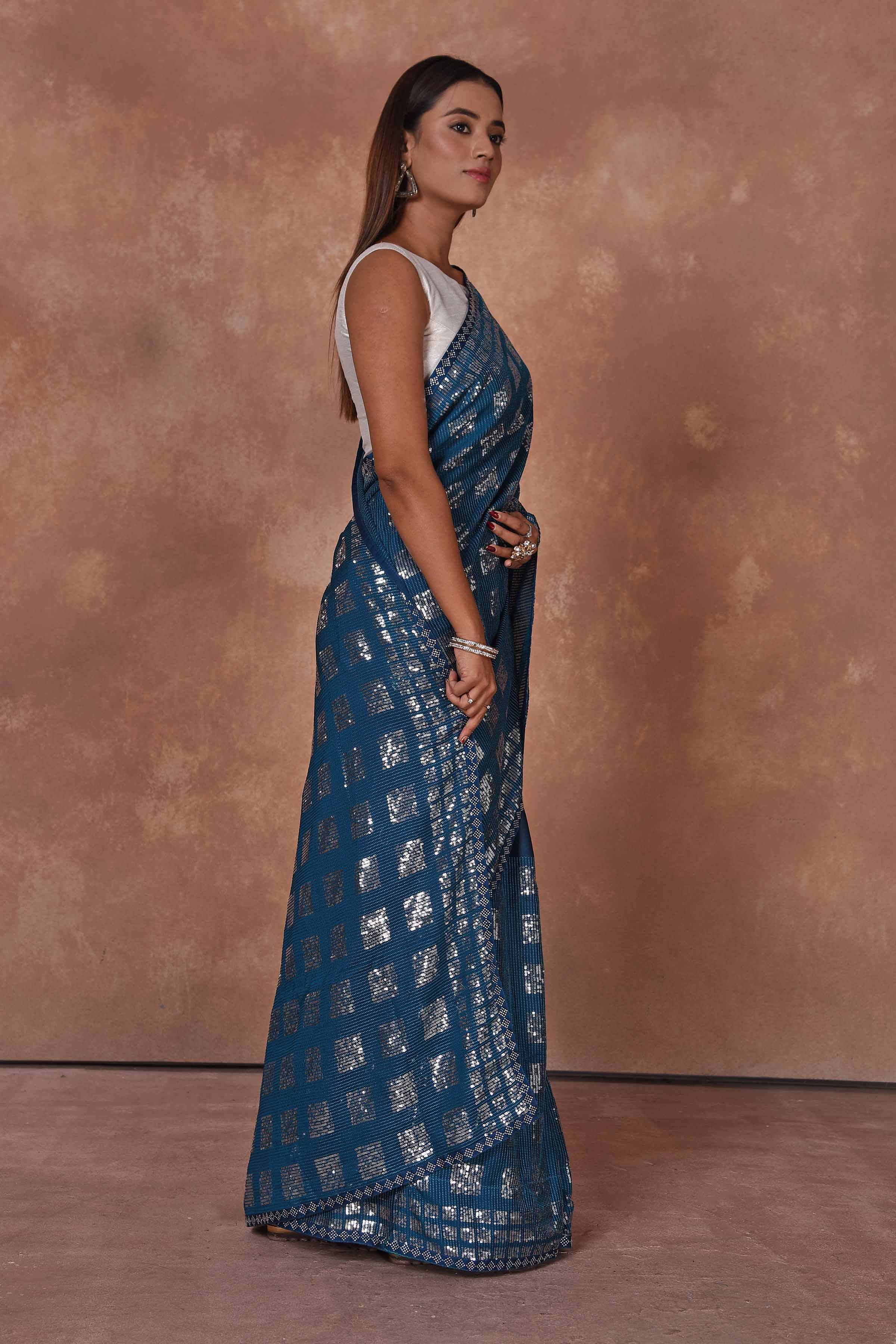 Buy blue and silver sequin work saree online in USA. Keep your ethnic wardrobe up to date with latest designer sarees, pure silk saris, Kanchipuram silk sarees, handwoven sarees, tussar silk saris, embroidered sarees, soft silk sarees from Pure Elegance Indian saree store in USA.-side