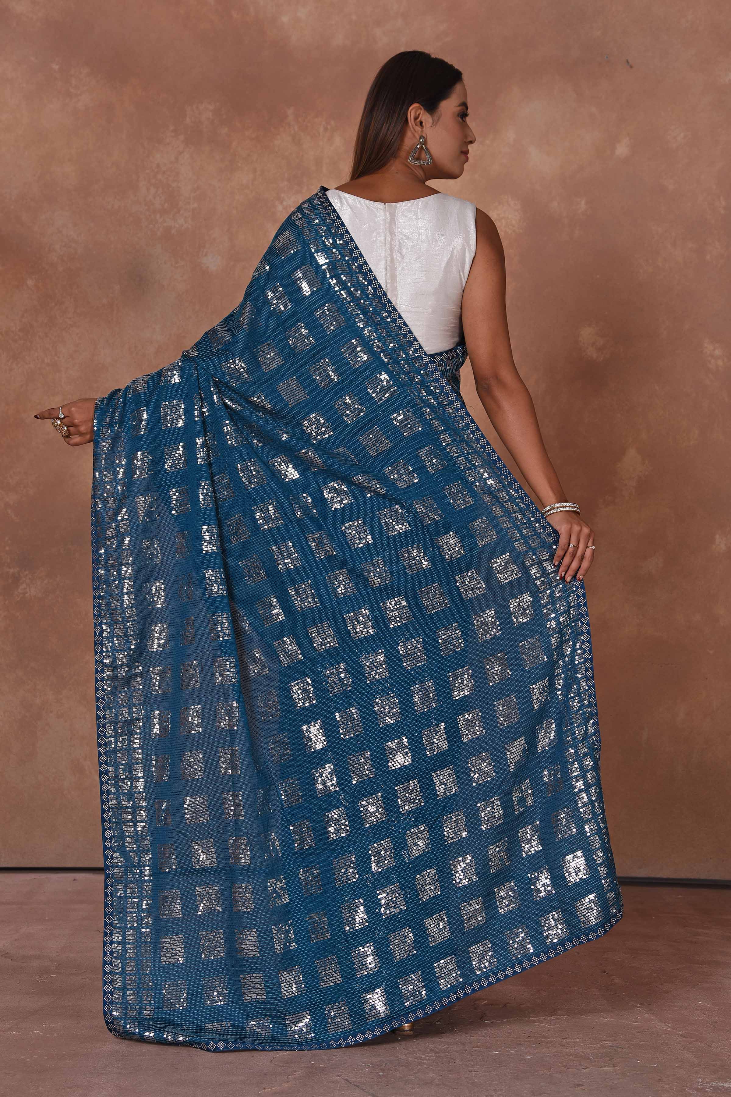 Buy blue and silver sequin work saree online in USA. Keep your ethnic wardrobe up to date with latest designer sarees, pure silk saris, Kanchipuram silk sarees, handwoven sarees, tussar silk saris, embroidered sarees, soft silk sarees from Pure Elegance Indian saree store in USA.back