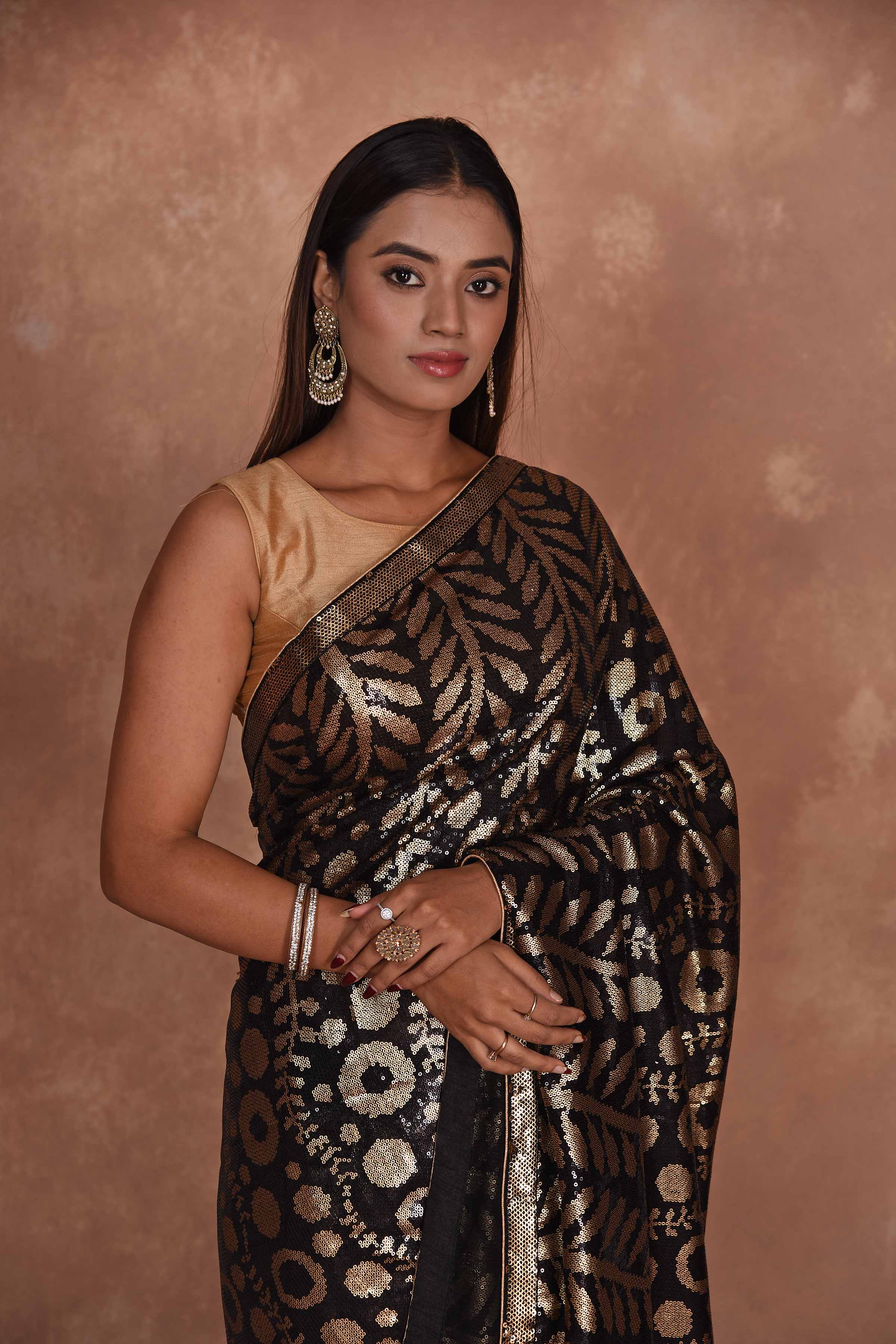 Buy beautiful black and golden sequin saree online in USA. Keep your ethnic wardrobe up to date with latest designer sarees, pure silk saris, Kanchipuram silk sarees, handwoven sarees, tussar silk saris, embroidered sarees, soft silk sarees from Pure Elegance Indian saree store in USA.-blouse