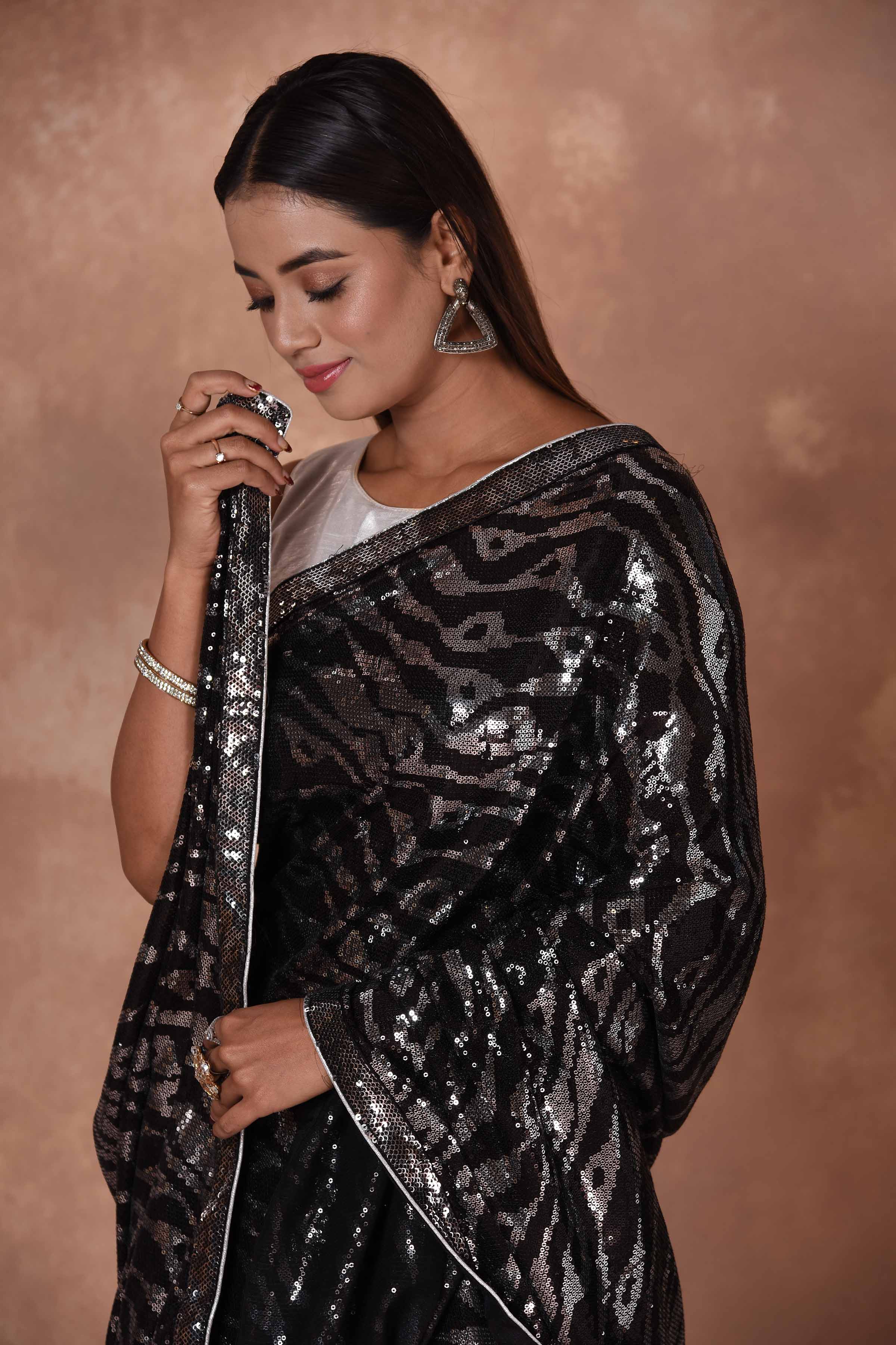 Buy stunning black and silver sequin work saree online in USA. Keep your ethnic wardrobe up to date with latest designer sarees, pure silk saris, Kanchipuram silk sarees, handwoven sarees, tussar silk saris, embroidered sarees, soft silk sarees from Pure Elegance Indian saree store in USA.-closeup