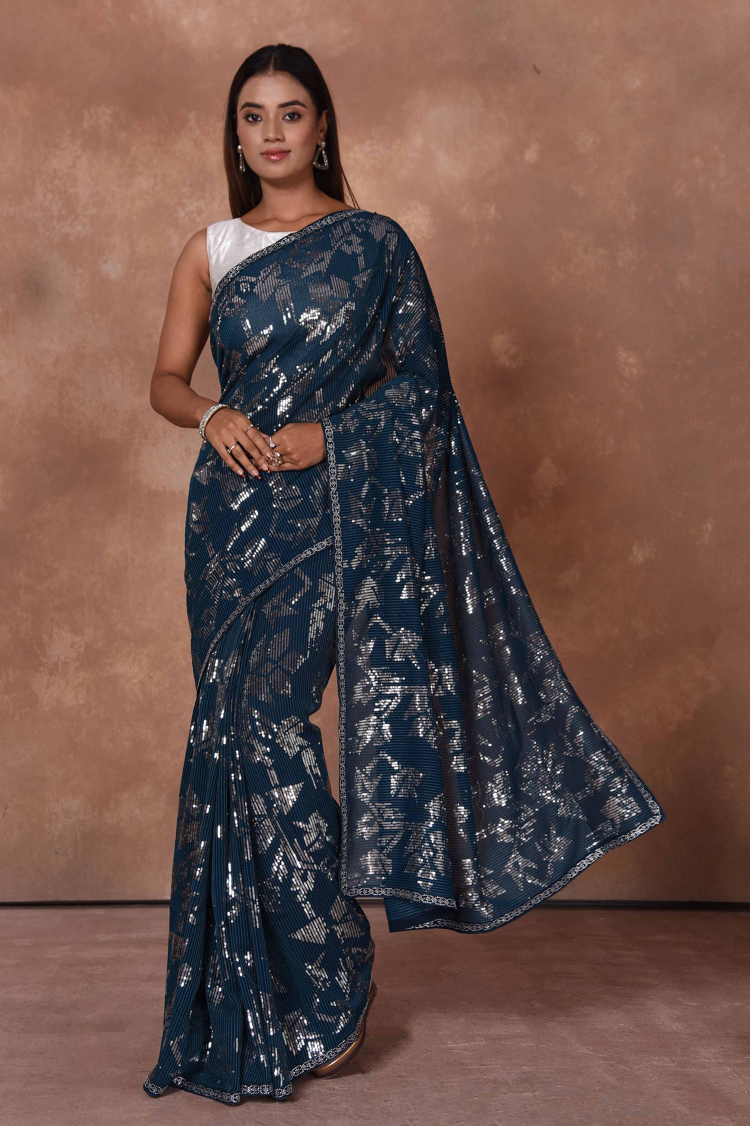 Shop stunning blue and silver sequin saree online in USA. Keep your ethnic wardrobe up to date with latest designer sarees, pure silk saris, Kanchipuram silk sarees, handwoven sarees, tussar silk saris, embroidered sarees, soft silk sarees from Pure Elegance Indian saree store in USA.-full view