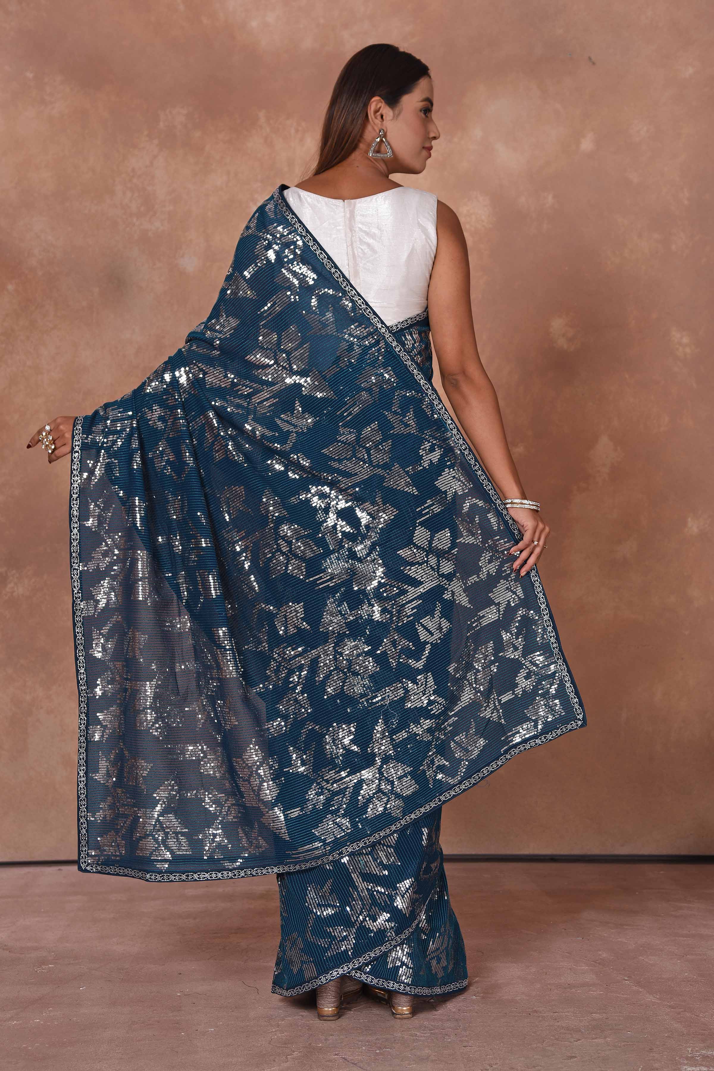 Shop stunning blue and silver sequin saree online in USA. Keep your ethnic wardrobe up to date with latest designer sarees, pure silk saris, Kanchipuram silk sarees, handwoven sarees, tussar silk saris, embroidered sarees, soft silk sarees from Pure Elegance Indian saree store in USA.-back