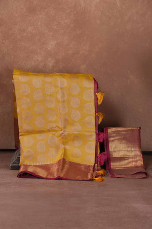 Shop yellow Kanjeevaram silk saree online in USA with pink zari border. Keep your ethnic wardrobe up to date with latest designer sarees, pure silk saris, Kanchipuram silk sarees, handwoven sarees, tussar silk saris, embroidered sarees, soft silk sarees, Kora silk sarees from Pure Elegance Indian saree store in USA.-blouse