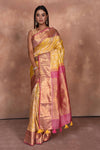 Shop yellow Kanjeevaram silk saree online in USA with pink zari border. Keep your ethnic wardrobe up to date with latest designer sarees, pure silk saris, Kanchipuram silk sarees, handwoven sarees, tussar silk saris, embroidered sarees, soft silk sarees, Kora silk sarees from Pure Elegance Indian saree store in USA.-full view
