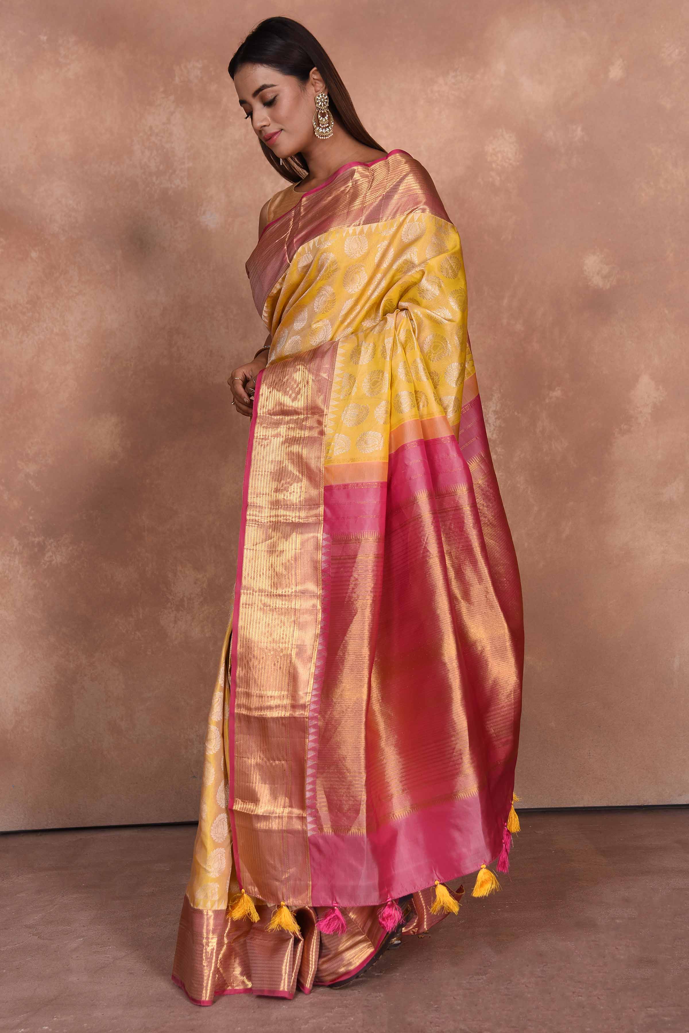 Shop yellow Kanjeevaram silk saree online in USA with pink zari border. Keep your ethnic wardrobe up to date with latest designer sarees, pure silk saris, Kanchipuram silk sarees, handwoven sarees, tussar silk saris, embroidered sarees, soft silk sarees, Kora silk sarees from Pure Elegance Indian saree store in USA.-pallu
