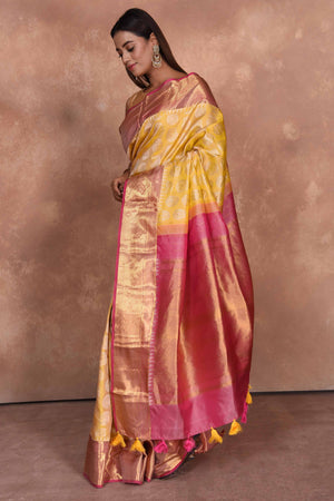Shop yellow Kanjeevaram silk saree online in USA with pink zari border. Keep your ethnic wardrobe up to date with latest designer sarees, pure silk saris, Kanchipuram silk sarees, handwoven sarees, tussar silk saris, embroidered sarees, soft silk sarees, Kora silk sarees from Pure Elegance Indian saree store in USA.-pallu
