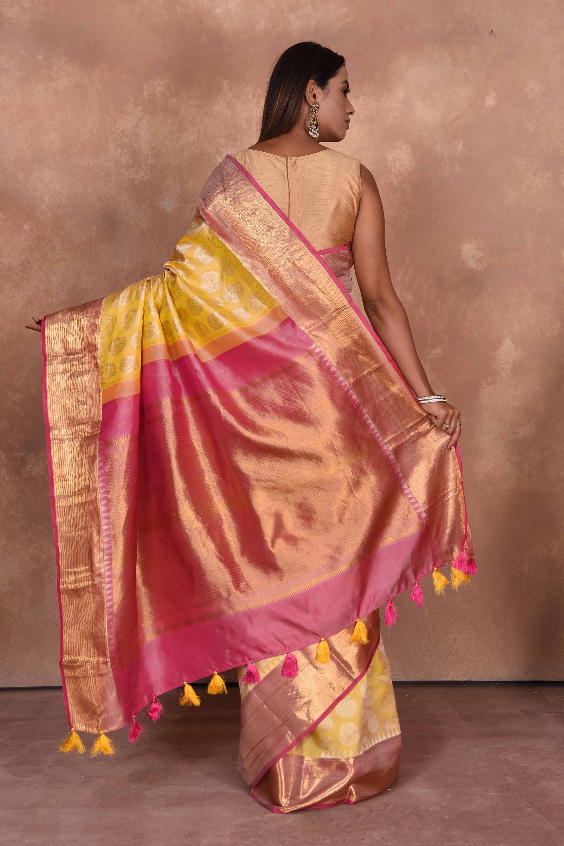 Shop yellow Kanjeevaram silk saree online in USA with pink zari border. Keep your ethnic wardrobe up to date with latest designer sarees, pure silk saris, Kanchipuram silk sarees, handwoven sarees, tussar silk saris, embroidered sarees, soft silk sarees, Kora silk sarees from Pure Elegance Indian saree store in USA.-back