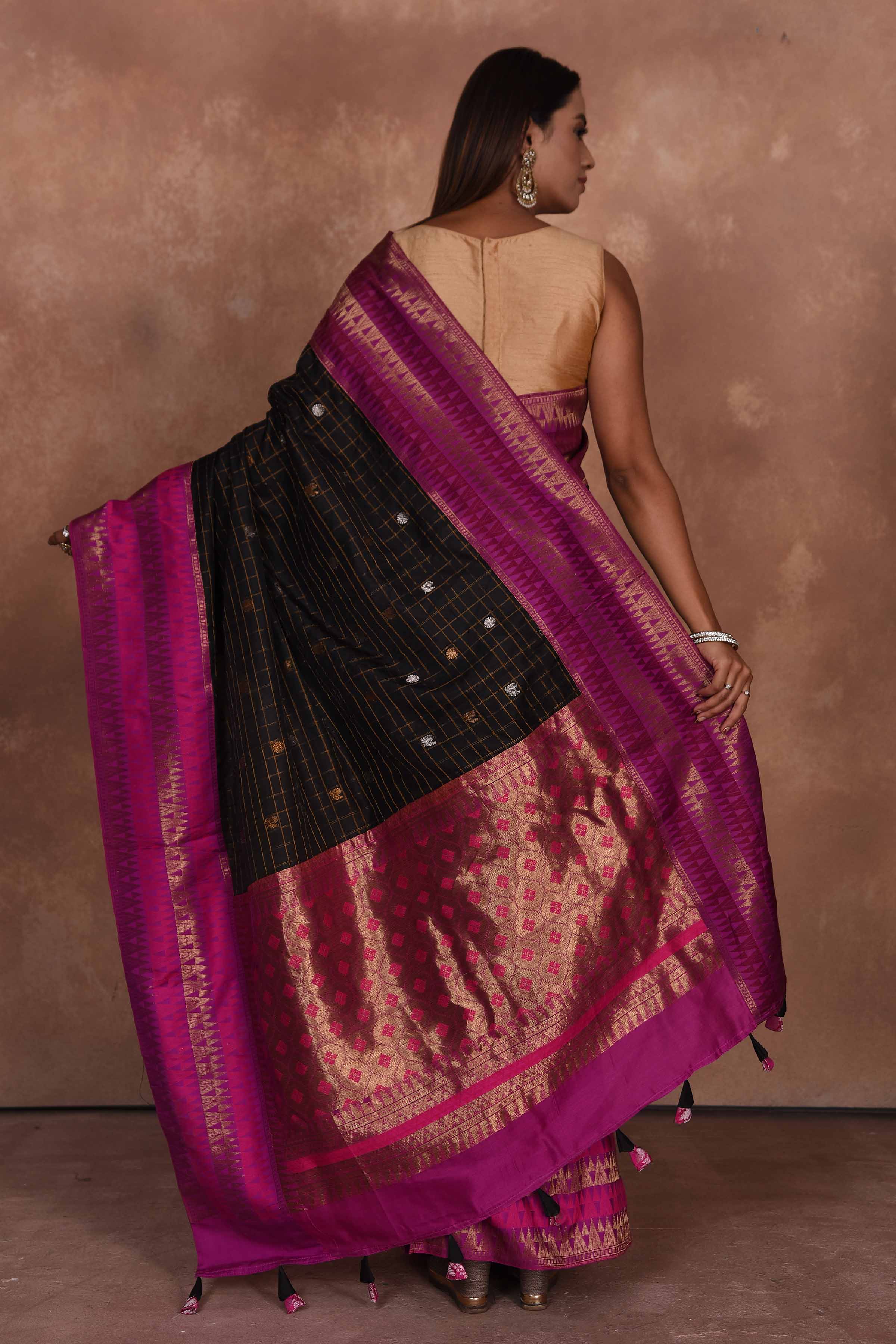 Buy beautiful black fancy Gadhwal sari online in USA with pink zari border. Keep your ethnic wardrobe up to date with latest designer sarees, pure silk saris, Kanchipuram silk sarees, handwoven sarees, tussar silk saris, embroidered sarees, soft silk sarees, Kora silk sarees from Pure Elegance Indian saree store in USA.-back
