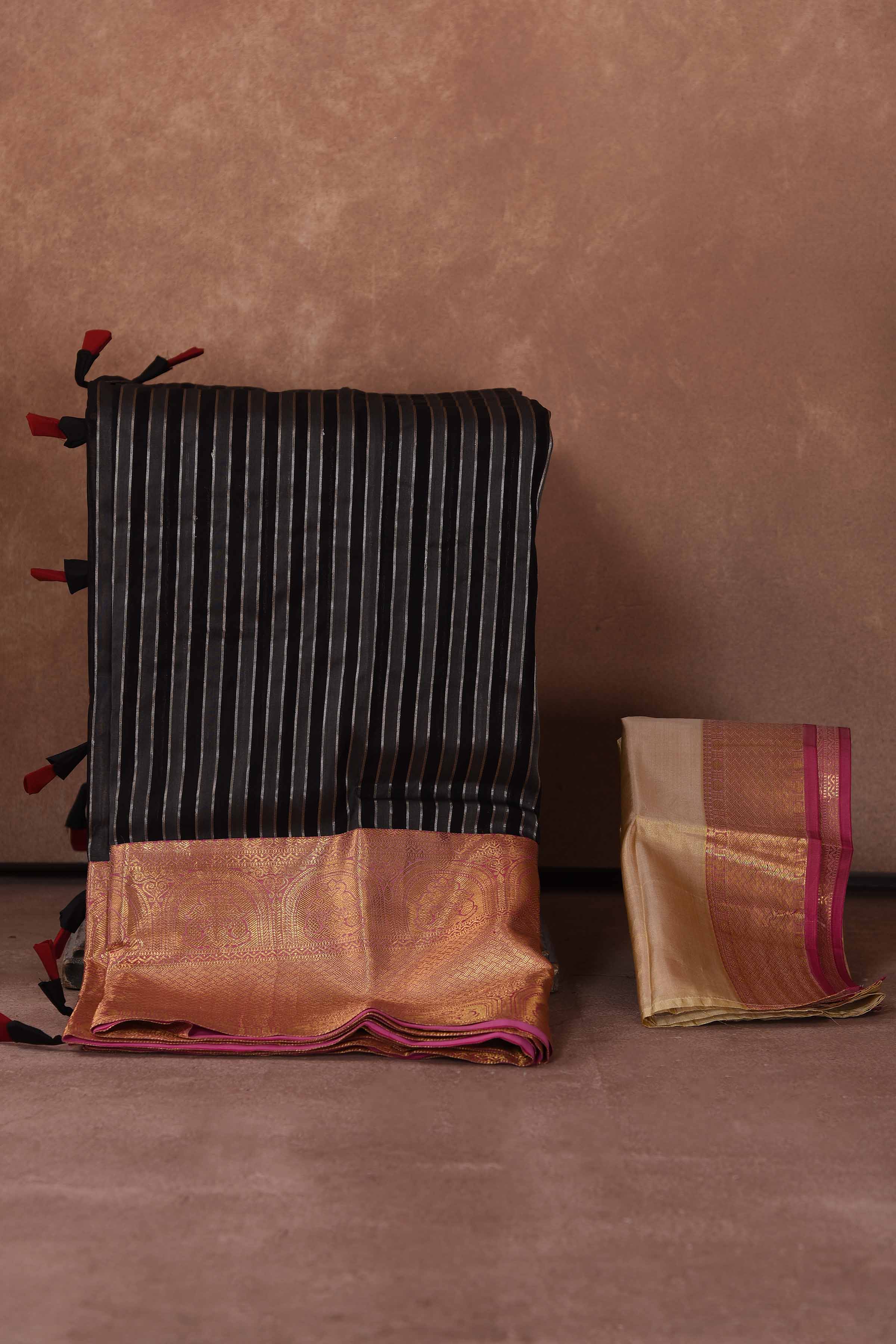Buy black striped Kanjeevaram Kora sari online in USA with red zari border. Keep your ethnic wardrobe up to date with latest designer sarees, pure silk saris, Kanchipuram silk sarees, handwoven sarees, tussar silk saris, embroidered sarees, soft silk sarees, Kora silk sarees from Pure Elegance Indian saree store in USA.-blouse