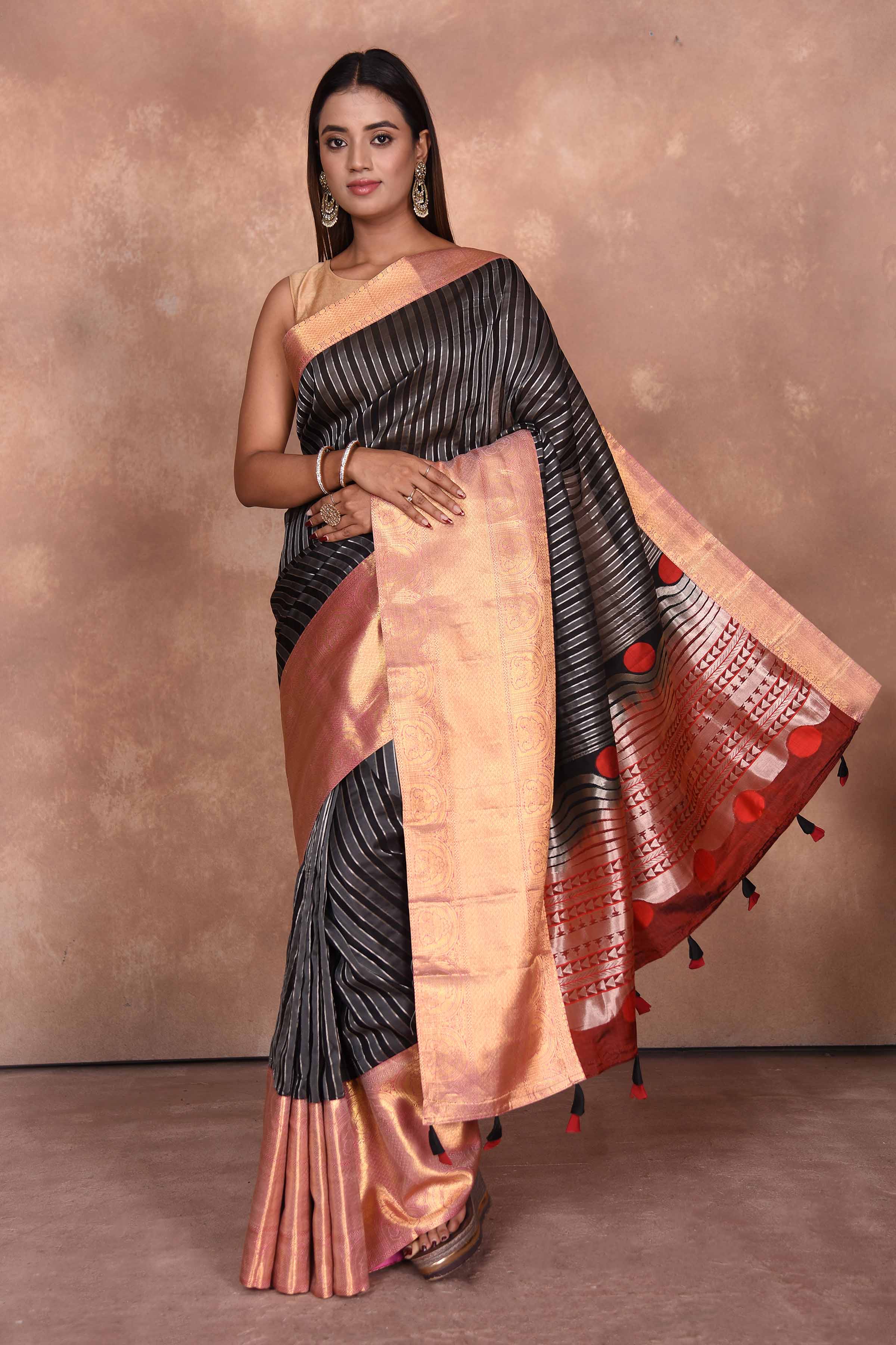 Buy black striped Kanjeevaram Kora sari online in USA with red zari border. Keep your ethnic wardrobe up to date with latest designer sarees, pure silk saris, Kanchipuram silk sarees, handwoven sarees, tussar silk saris, embroidered sarees, soft silk sarees, Kora silk sarees from Pure Elegance Indian saree store in USA.-full view
