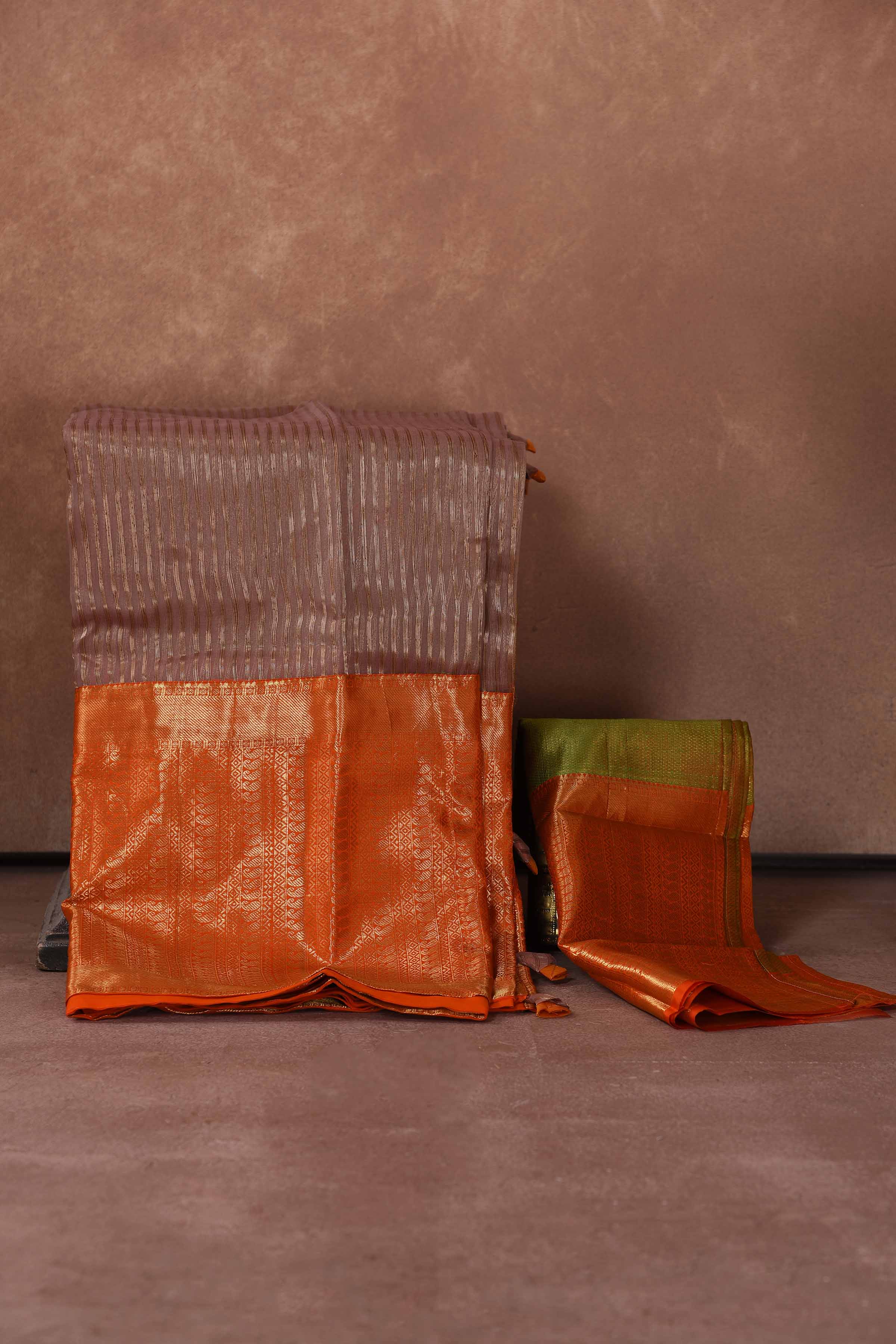 Buy beige striped Kanjeevaram Kora sari online in USA with orange zari border. Keep your ethnic wardrobe up to date with latest designer sarees, pure silk saris, Kanchipuram silk sarees, handwoven sarees, tussar silk saris, embroidered sarees, soft silk sarees, Kora silk sarees from Pure Elegance Indian saree store in USA.-back