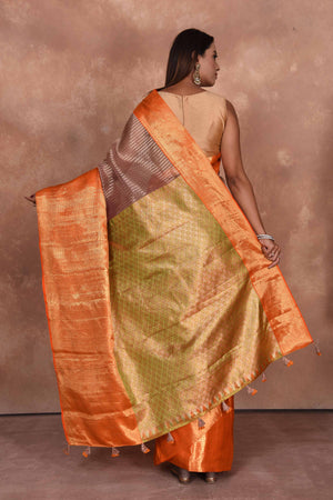 Buy beige striped Kanjeevaram Kora sari online in USA with orange zari border. Keep your ethnic wardrobe up to date with latest designer sarees, pure silk saris, Kanchipuram silk sarees, handwoven sarees, tussar silk saris, embroidered sarees, soft silk sarees, Kora silk sarees from Pure Elegance Indian saree store in USA.-back