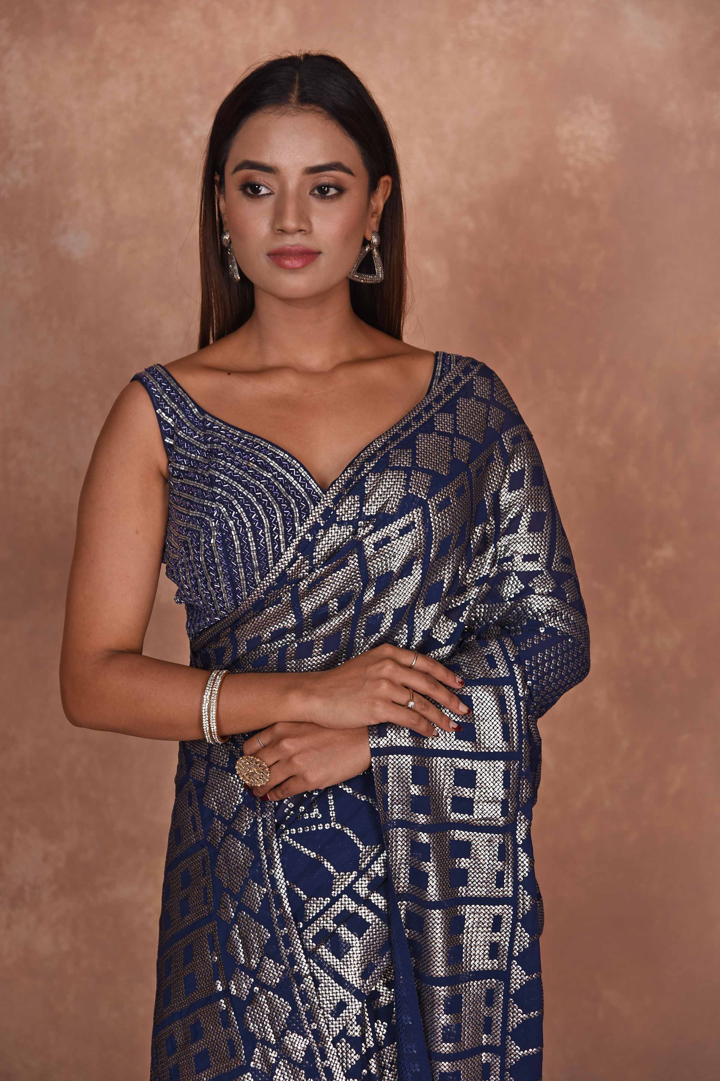 Buy blue sequin work georgette saree online in USA with embroidered blouse. Dazzle on weddings and special occasions with exquisite Indian designer dresses, embroidered sarees, partywear sarees, Bollywood sarees, handloom sarees from Pure Elegance Indian clothing store in USA.-closeup
