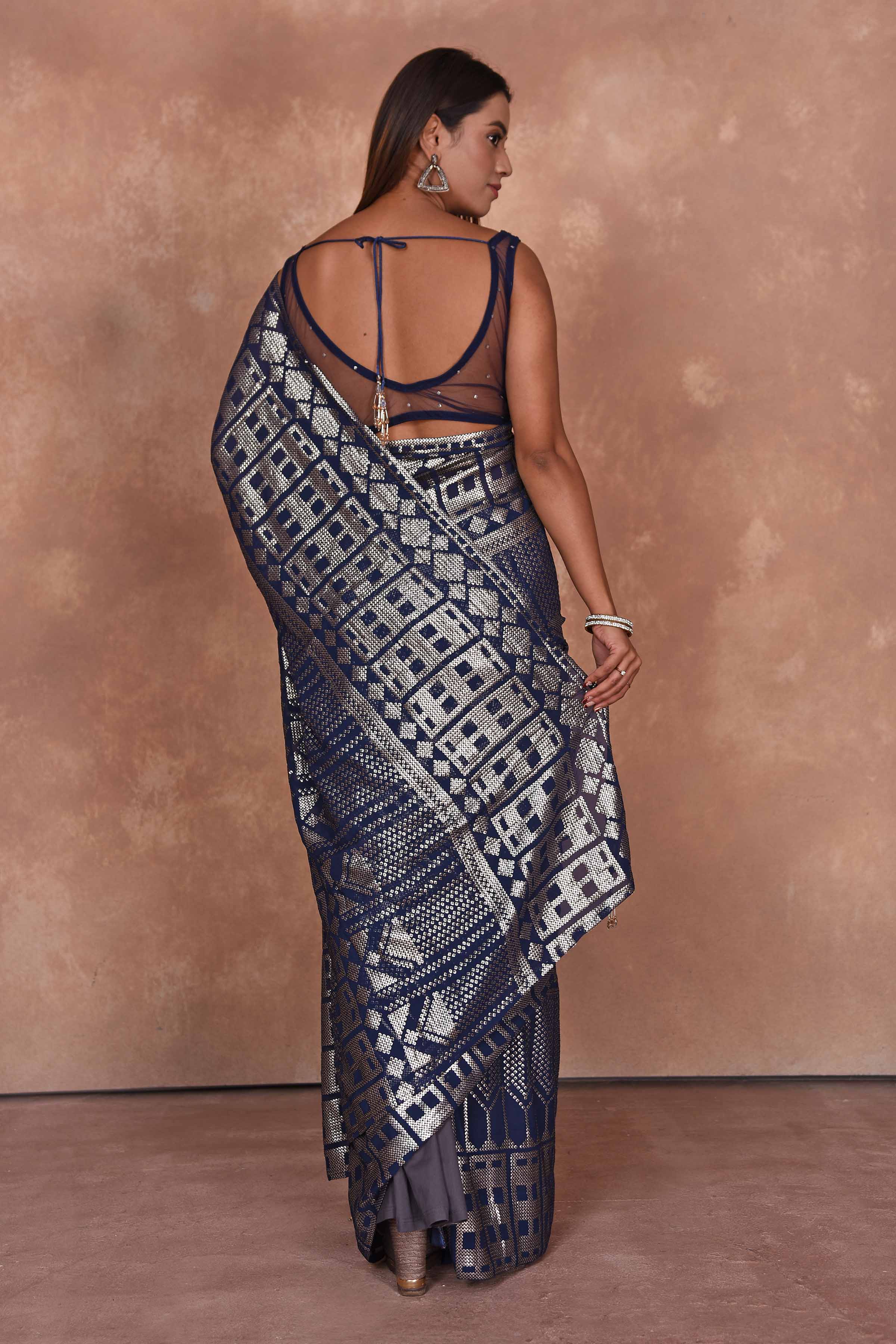 Buy blue sequin work georgette saree online in USA with embroidered blouse. Dazzle on weddings and special occasions with exquisite Indian designer dresses, embroidered sarees, partywear sarees, Bollywood sarees, handloom sarees from Pure Elegance Indian clothing store in USA.-back