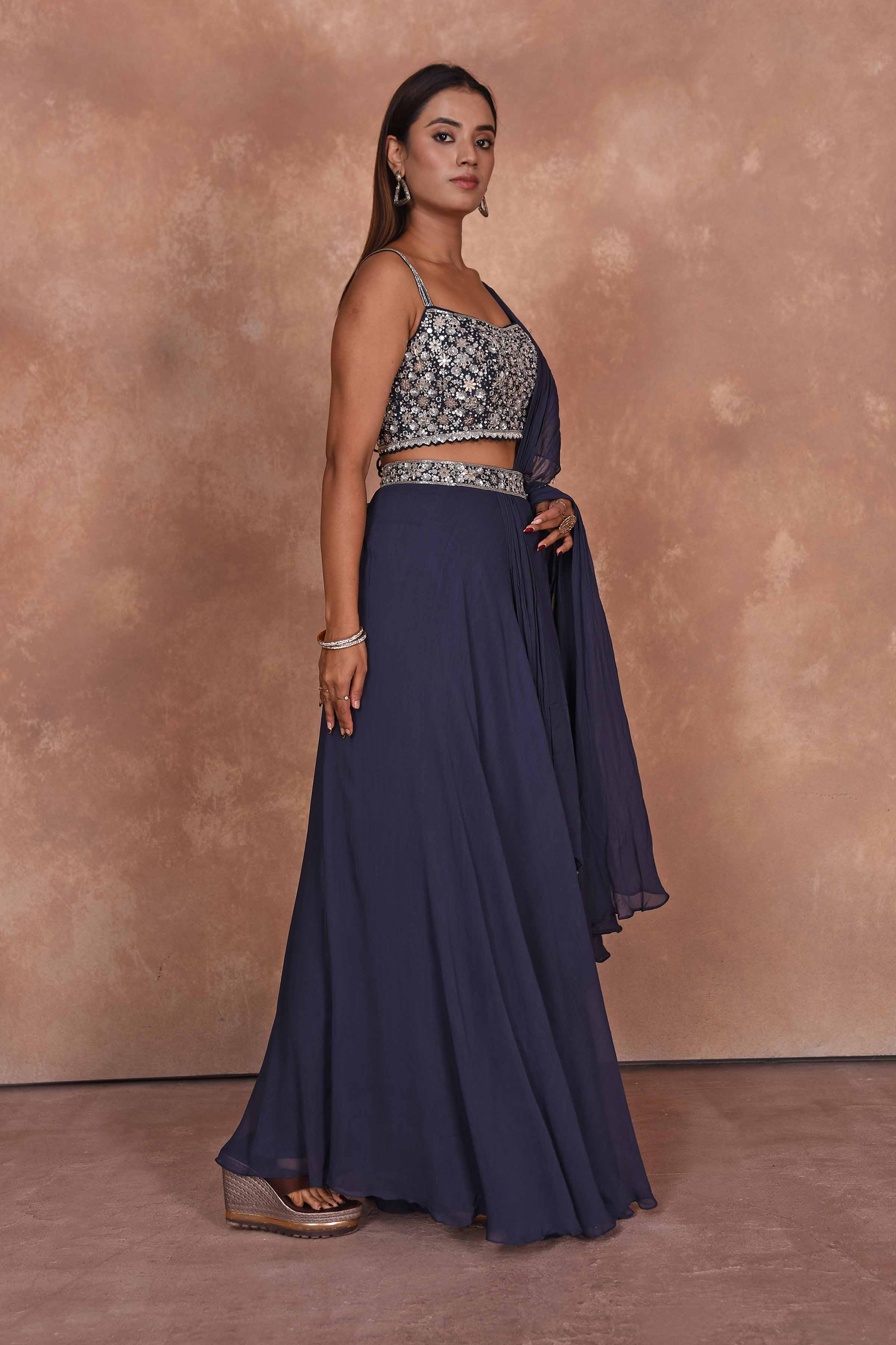 Buy dark blue designer lehenga saree online in USA with embroidered blouse. Dazzle on weddings and special occasions with exquisite Indian designer dresses, embroidered sarees, partywear sarees, Bollywood sarees, handloom sarees from Pure Elegance Indian clothing store in USA.-side