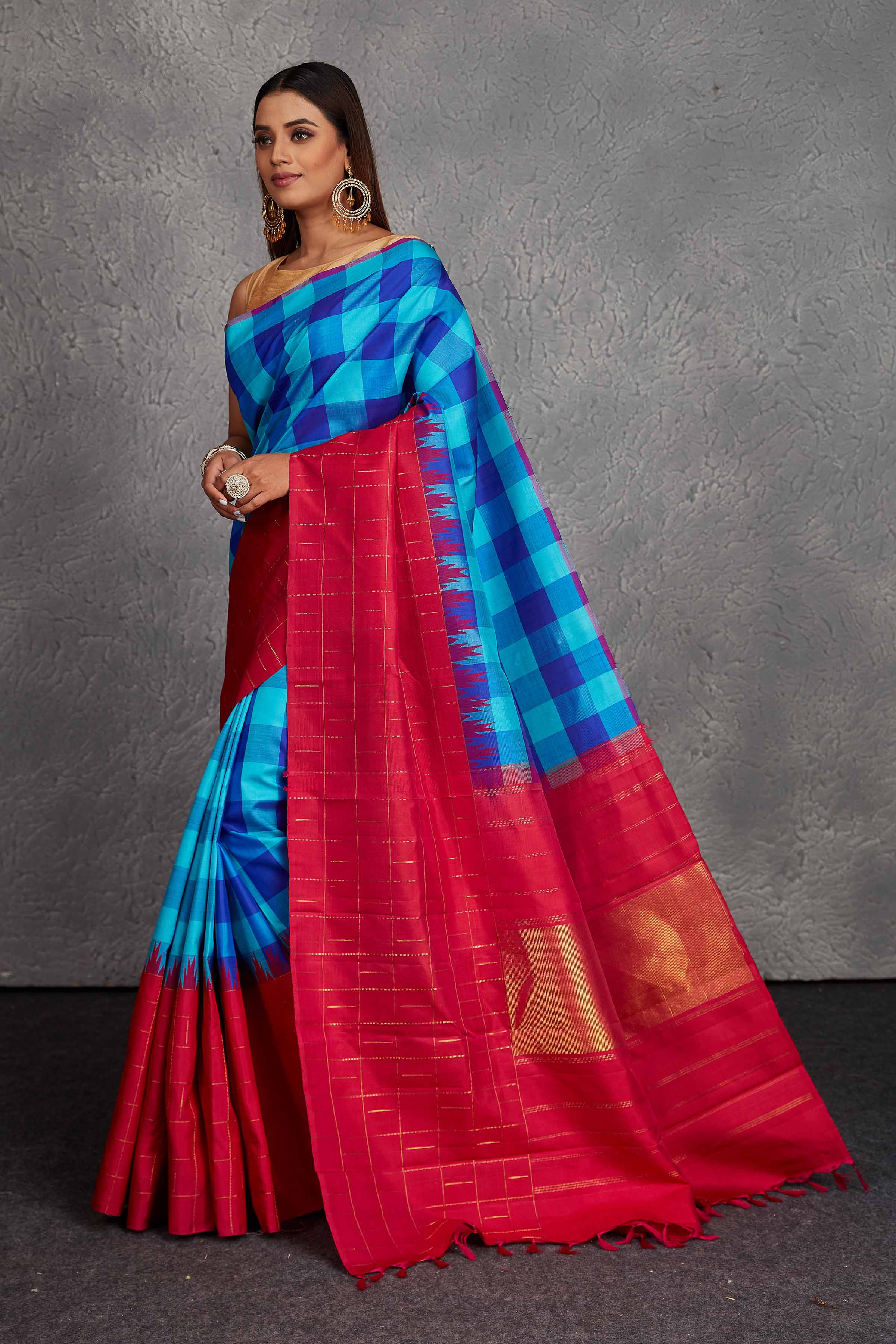 Buy beautiful blue checker Kanjivaram silk sari online in USA with pink border. Get festive ready in beautiful Kanchipuram silk saris, pure silk sarees, soft silk sarees, tussar silk saris, handwoven sarees, chanderi silk sarees from Pure Elegance Indian fashion store in USA.-pallu