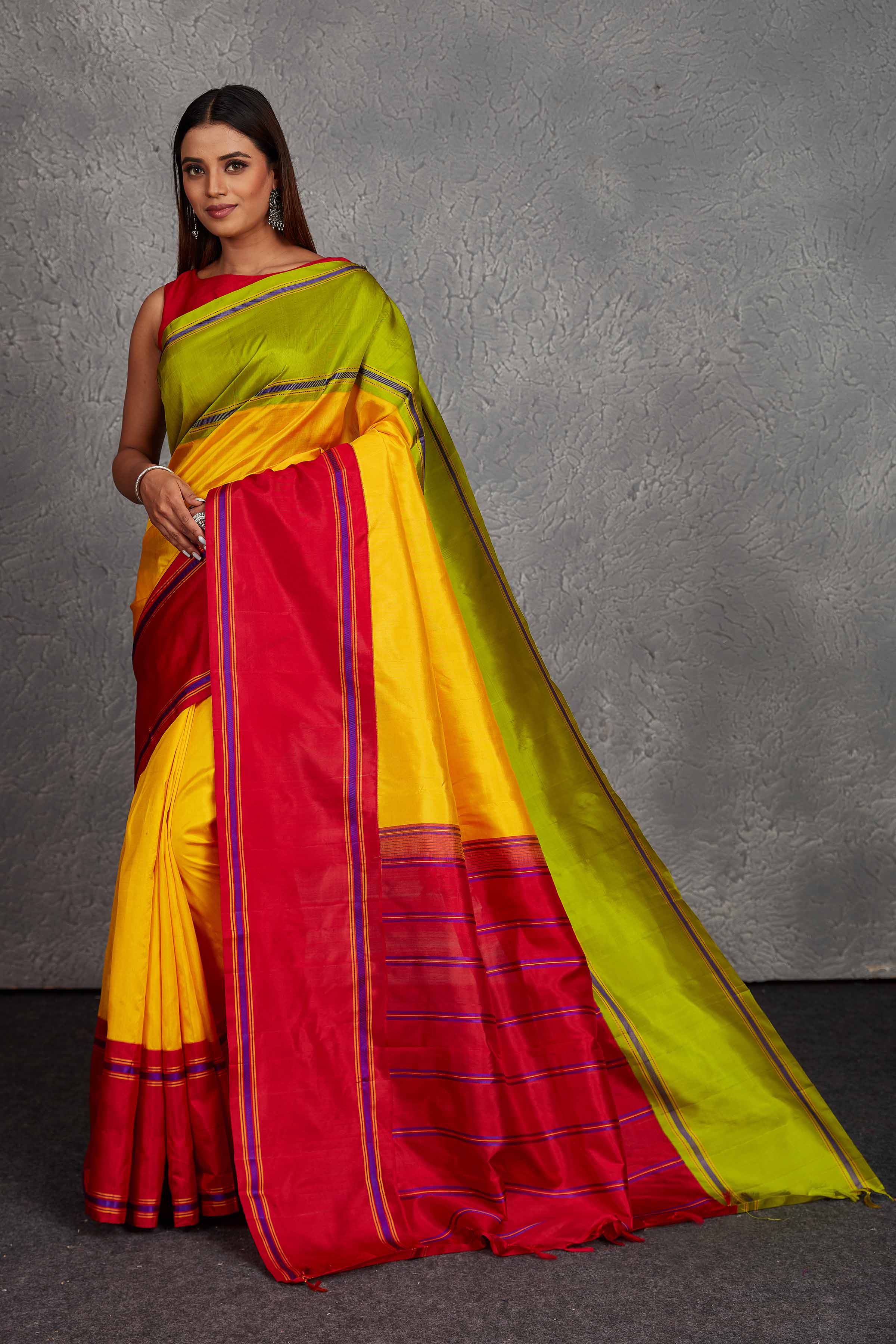 Buy beautiful yellow Kanjivaram silk saree online in USA with red and green border. Get festive ready in beautiful Kanchipuram silk saris, pure silk sarees, soft silk sarees, tussar silk saris, handwoven sarees, chanderi silk sarees from Pure Elegance Indian fashion store in USA.-full view