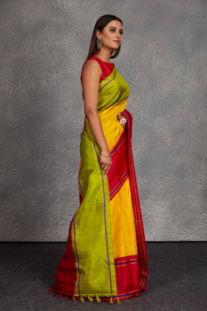 Buy beautiful yellow Kanjivaram silk saree online in USA with red and green border. Get festive ready in beautiful Kanchipuram silk saris, pure silk sarees, soft silk sarees, tussar silk saris, handwoven sarees, chanderi silk sarees from Pure Elegance Indian fashion store in USA.-side