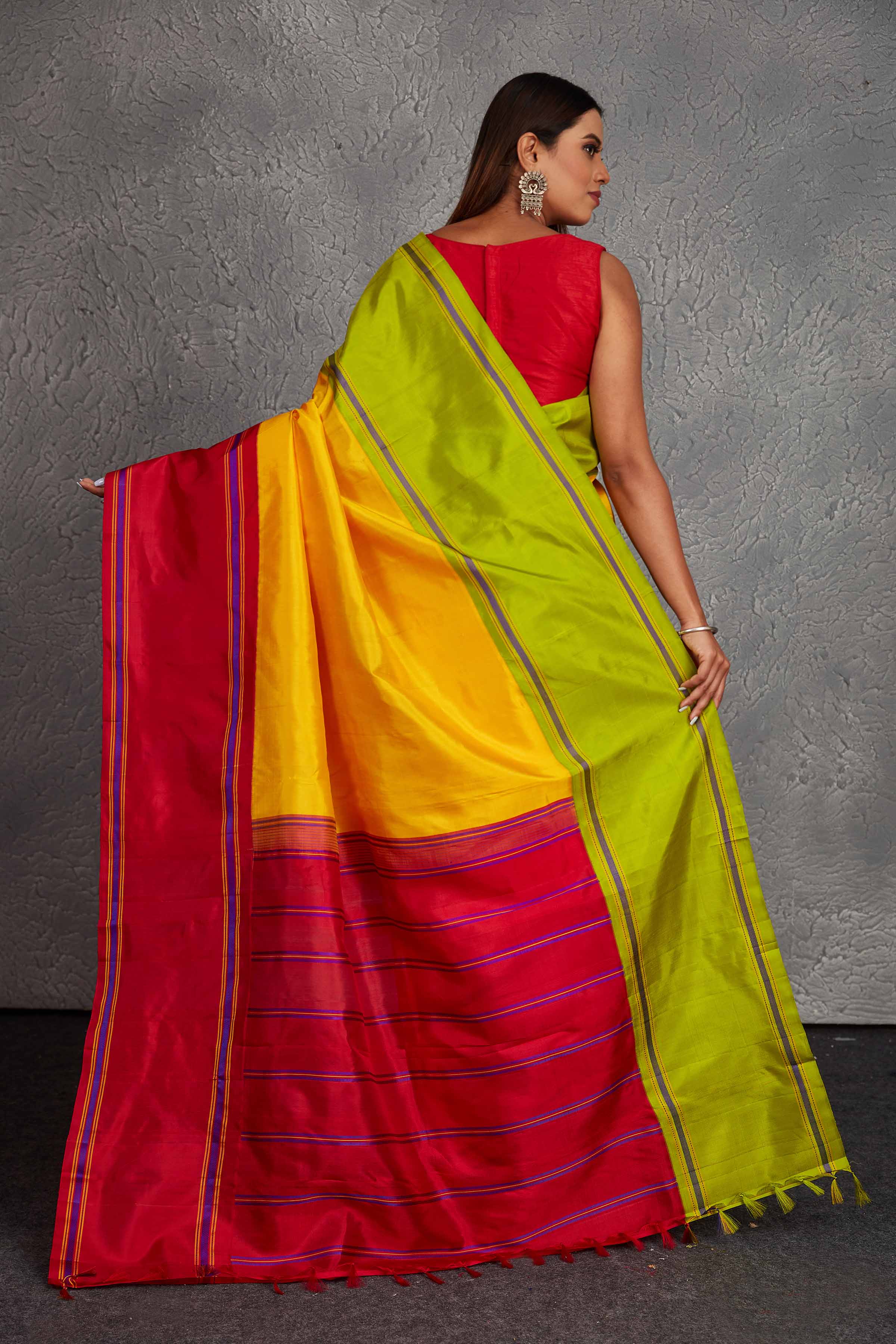 Buy beautiful yellow Kanjivaram silk saree online in USA with red and green border. Get festive ready in beautiful Kanchipuram silk saris, pure silk sarees, soft silk sarees, tussar silk saris, handwoven sarees, chanderi silk sarees from Pure Elegance Indian fashion store in USA.-back