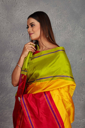 Buy beautiful yellow Kanjivaram silk saree online in USA with red and green border. Get festive ready in beautiful Kanchipuram silk saris, pure silk sarees, soft silk sarees, tussar silk saris, handwoven sarees, chanderi silk sarees from Pure Elegance Indian fashion store in USA.-closeup