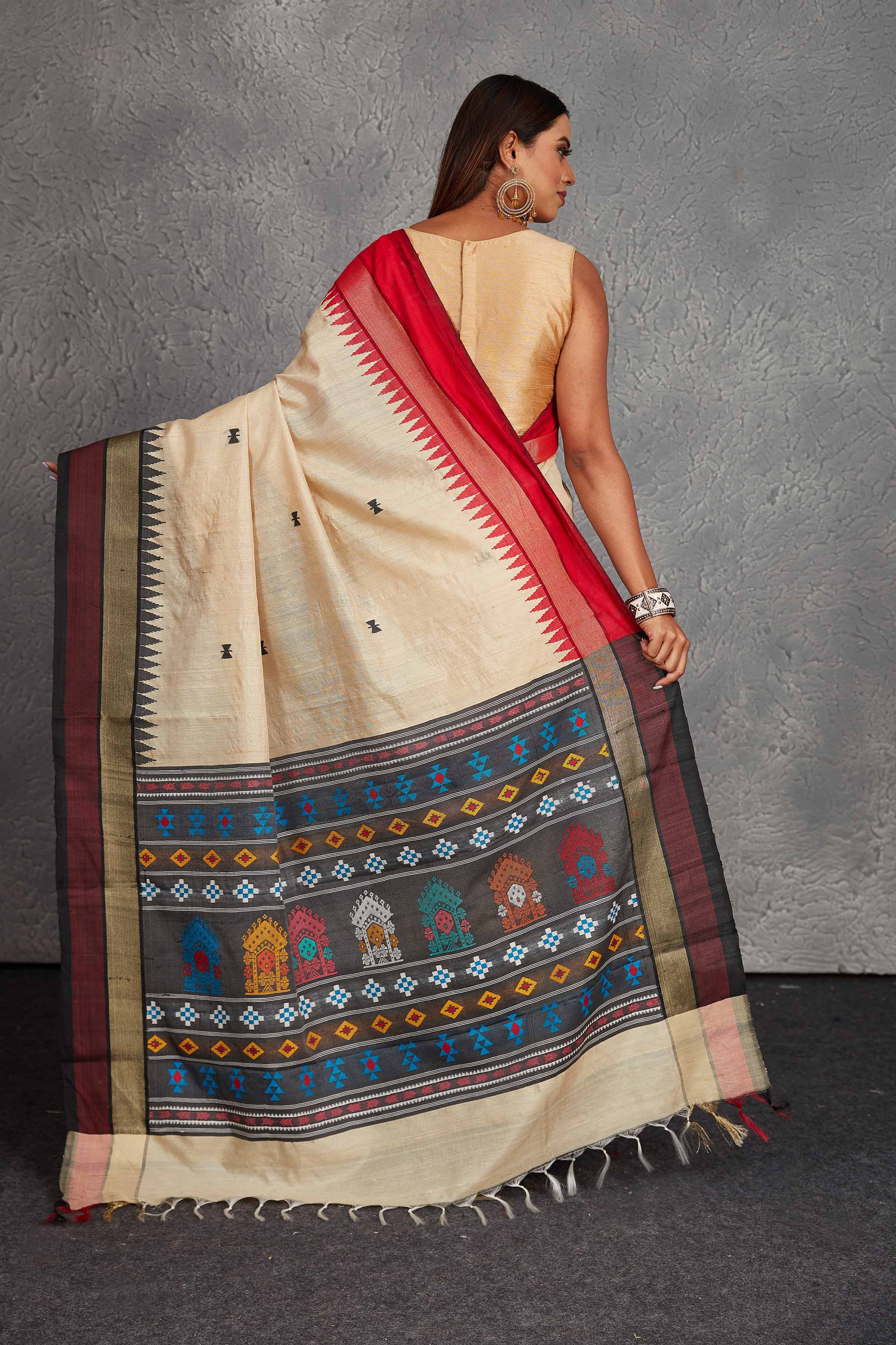 Buy beautiful cream tussar silk saree online in USA with multicolor weave pallu. Get festive ready in beautiful Kanchipuram silk saris, pure silk sarees, soft silk sarees, tussar silk saris, handwoven sarees, chanderi silk sarees from Pure Elegance Indian fashion store in USA.-back