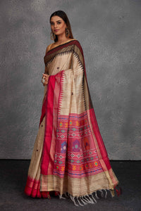 Buy beautiful beige tussar silk saree online in USA with pink multicolor weave pallu. Get festive ready in beautiful Kanchipuram silk saris, pure silk sarees, soft silk sarees, tussar silk saris, handwoven sarees, chanderi silk sarees from Pure Elegance Indian fashion store in USA.-full view