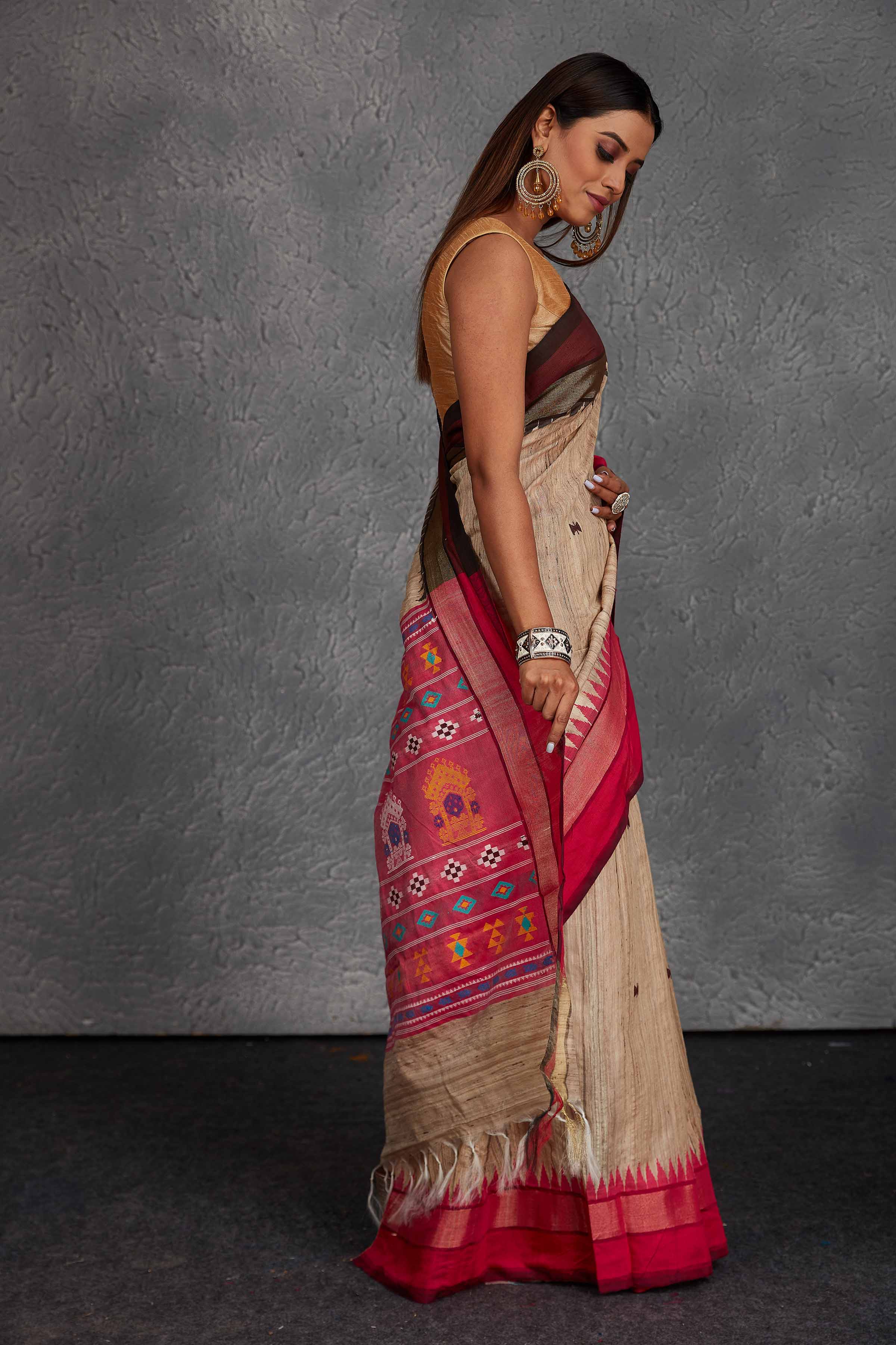 Buy beautiful beige tussar silk saree online in USA with pink multicolor weave pallu. Get festive ready in beautiful Kanchipuram silk saris, pure silk sarees, soft silk sarees, tussar silk saris, handwoven sarees, chanderi silk sarees from Pure Elegance Indian fashion store in USA.-side