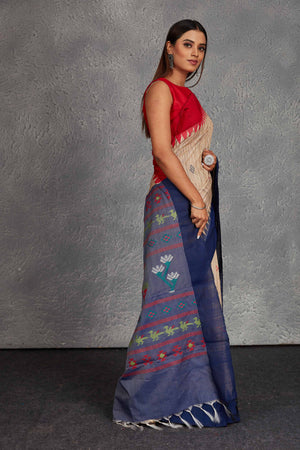 Shop beautiful beige tussar silk sari online in USA with blue weave pallu. Get festive ready in beautiful Kanchipuram silk saris, pure silk sarees, soft silk sarees, tussar silk saris, handwoven sarees, chanderi silk sarees from Pure Elegance Indian fashion store in USA.-side
