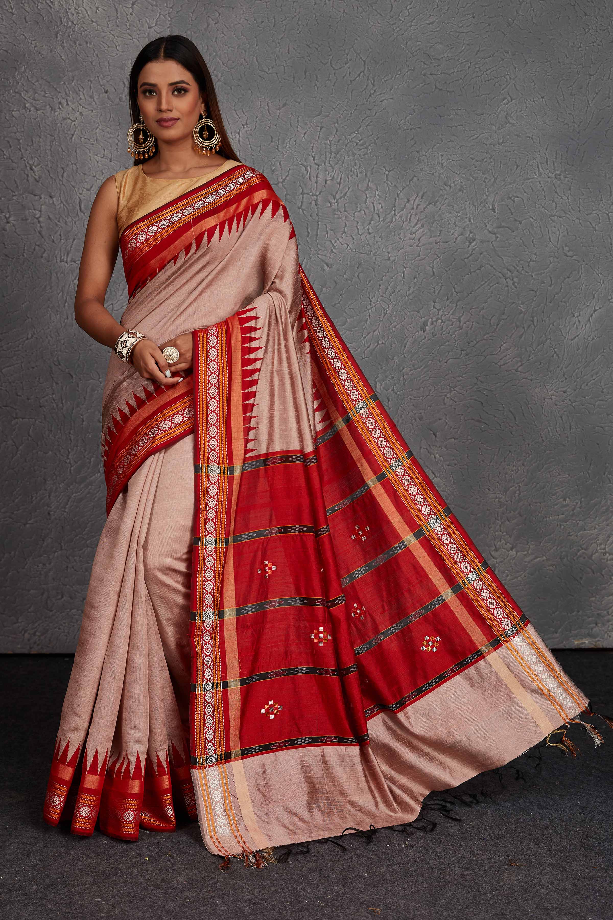 Buy dusty pink tussar silk sari online in USA with red temple border. Get festive ready in beautiful Kanchipuram silk saris, pure silk sarees, soft silk sarees, tussar silk saris, handwoven sarees, chanderi silk sarees from Pure Elegance Indian fashion store in USA.-full view