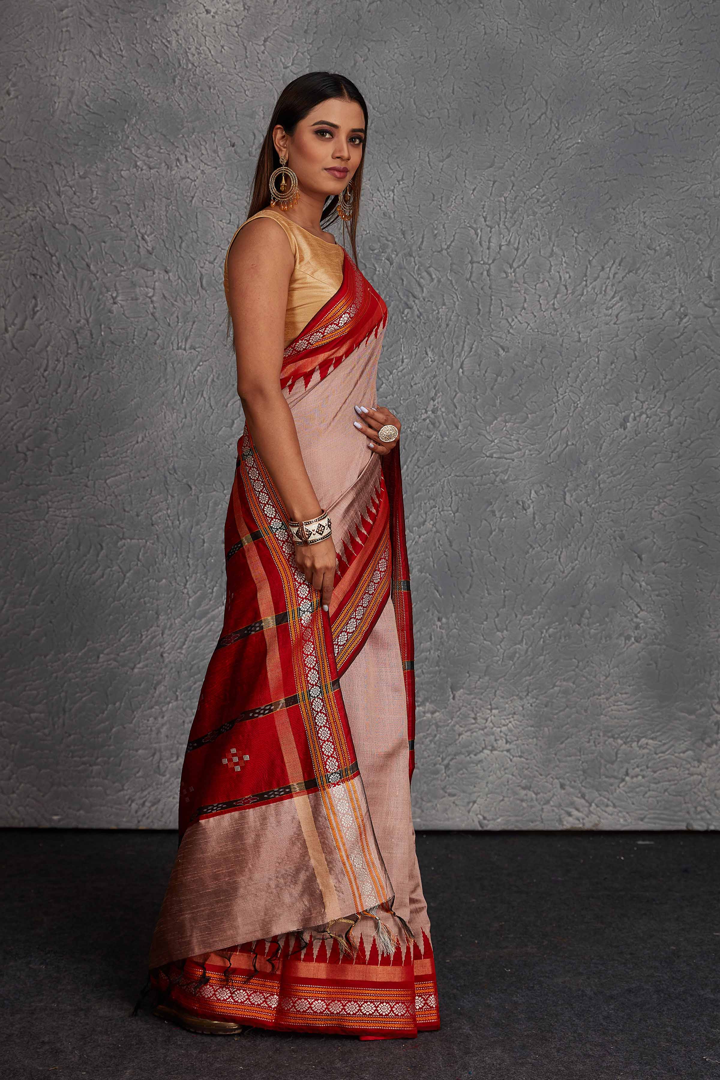Buy dusty pink tussar silk sari online in USA with red temple border. Get festive ready in beautiful Kanchipuram silk saris, pure silk sarees, soft silk sarees, tussar silk saris, handwoven sarees, chanderi silk sarees from Pure Elegance Indian fashion store in USA.-side
