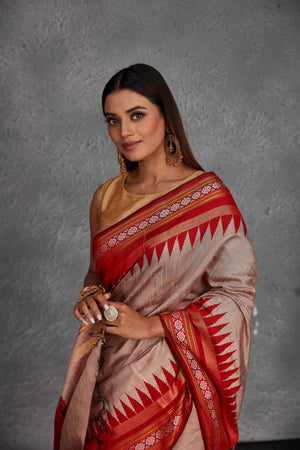 Buy dusty pink tussar silk sari online in USA with red temple border. Get festive ready in beautiful Kanchipuram silk saris, pure silk sarees, soft silk sarees, tussar silk saris, handwoven sarees, chanderi silk sarees from Pure Elegance Indian fashion store in USA.-closeup