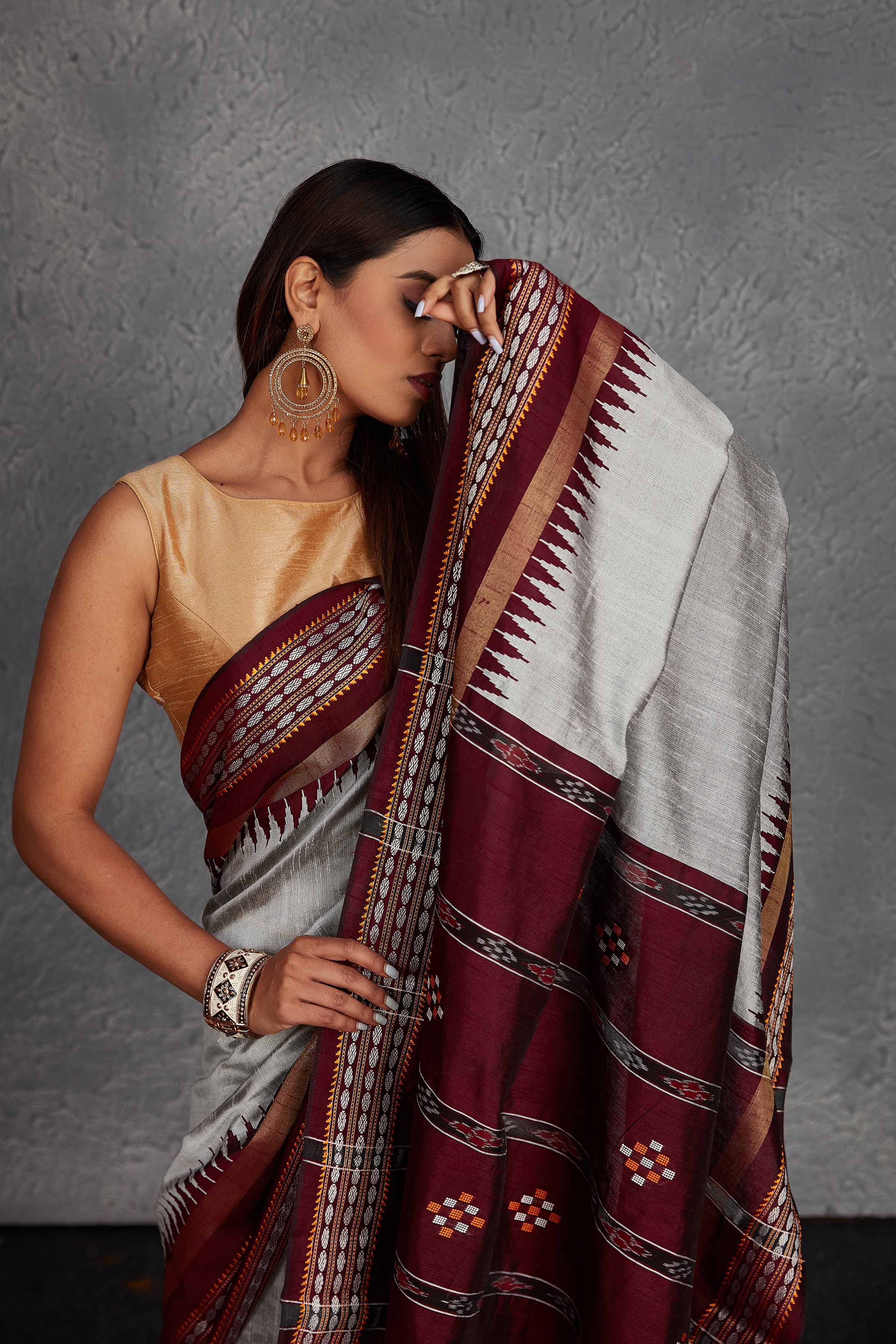 Shop beautiful light grey tussar silk sari online in USA with maroon temple border. Get festive ready in beautiful Kanchipuram silk saris, pure silk sarees, soft silk sarees, tussar silk saris, handwoven sarees, chanderi silk sarees from Pure Elegance Indian fashion store in USA.-closeup