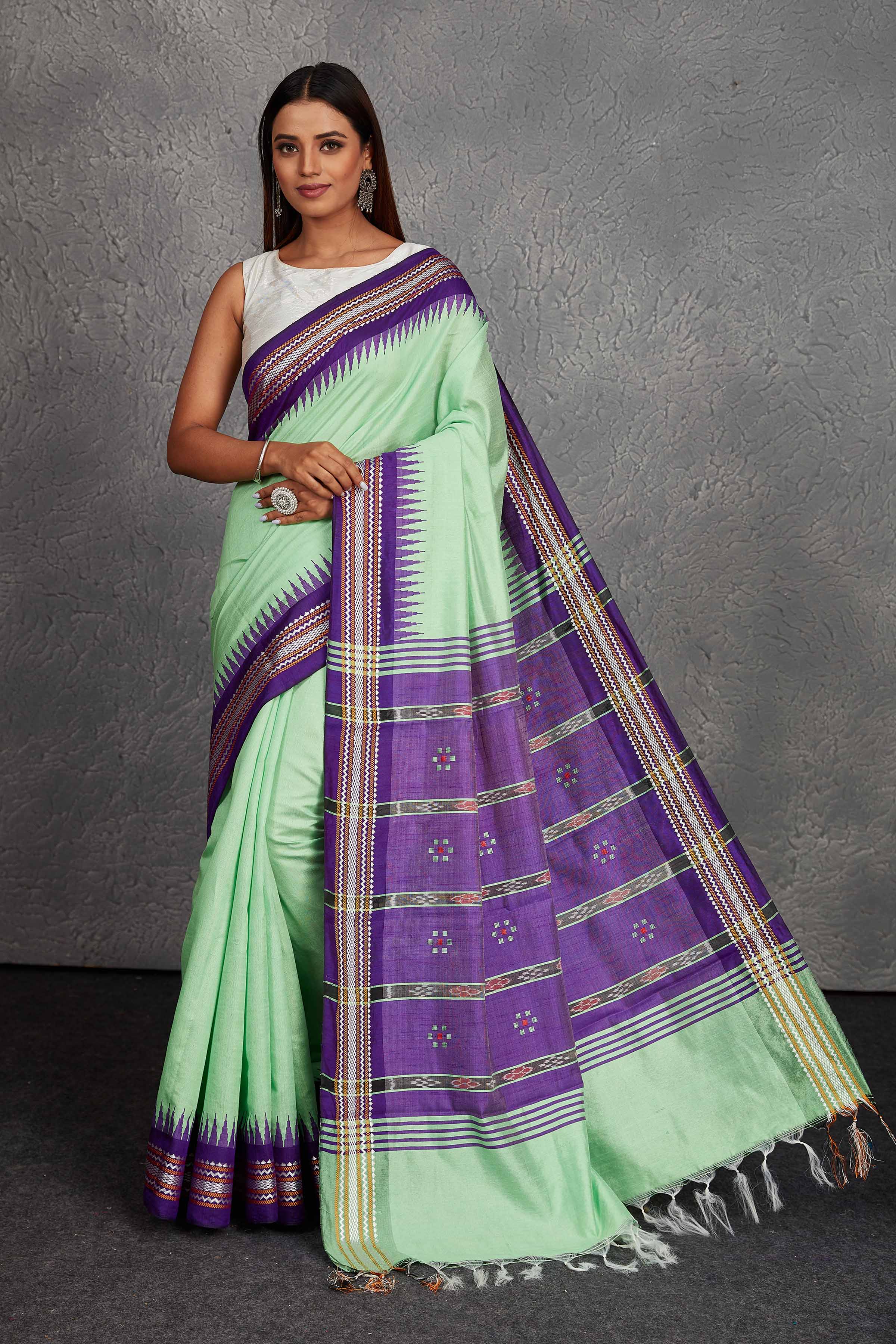 Shop beautiful mint green tussar silk sari online in USA with purple border and pallu. Get festive ready in beautiful Kanchipuram silk saris, pure silk sarees, soft silk sarees, tussar silk saris, handwoven sarees, chanderi silk sarees from Pure Elegance Indian fashion store in USA.-full view