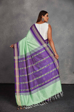 Shop beautiful mint green tussar silk sari online in USA with purple border and pallu. Get festive ready in beautiful Kanchipuram silk saris, pure silk sarees, soft silk sarees, tussar silk saris, handwoven sarees, chanderi silk sarees from Pure Elegance Indian fashion store in USA.-back