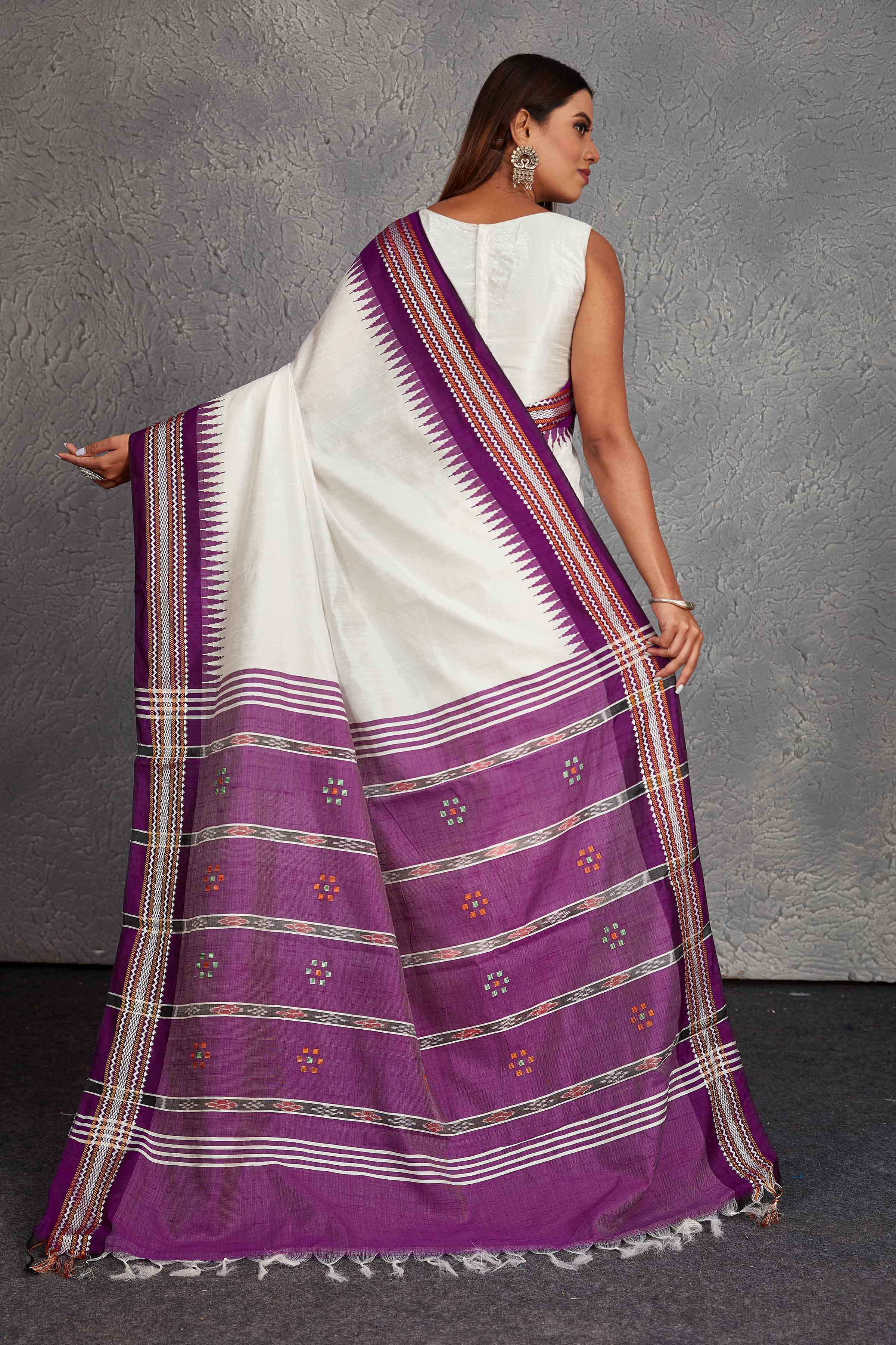Shop white tussar silk sari online in USA with purple border and pallu. Get festive ready in beautiful Kanchipuram silk saris, pure silk sarees, soft silk sarees, tussar silk saris, handwoven sarees, chanderi silk sarees from Pure Elegance Indian fashion store in USA.-back