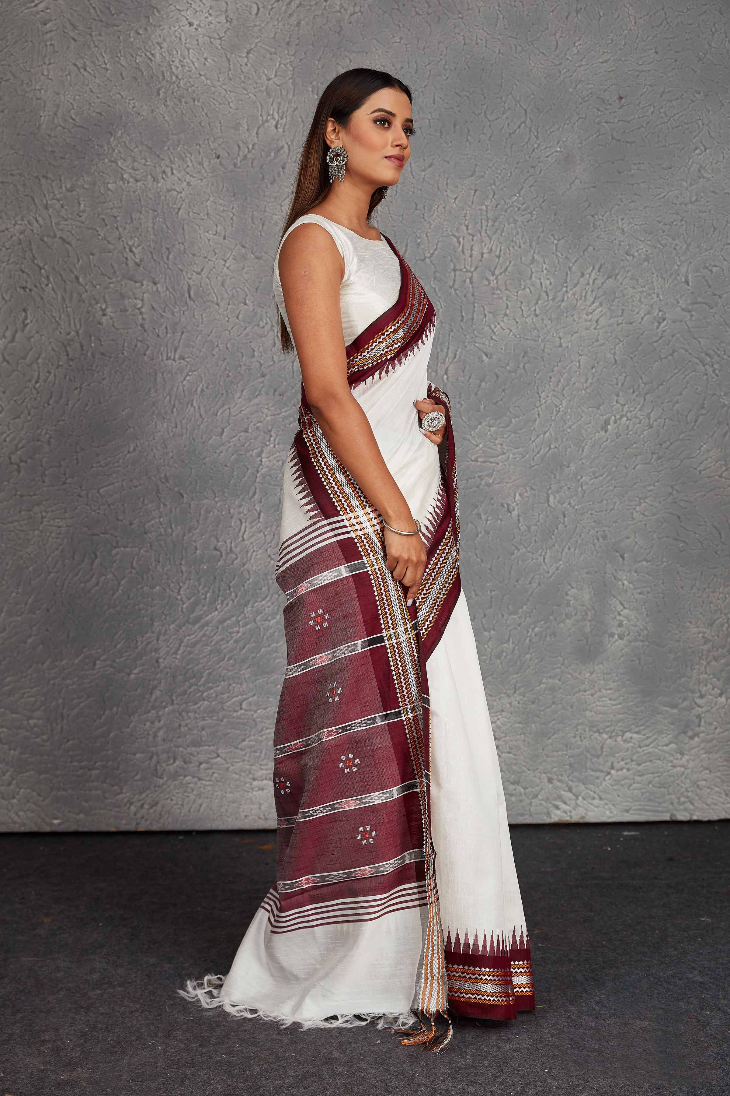 Shop elegant white tussar silk saree online in USA with maroon border and pallu. Get festive ready in beautiful Kanchipuram silk saris, pure silk sarees, soft silk sarees, tussar silk saris, handwoven sarees, chanderi silk sarees from Pure Elegance Indian fashion store in USA.-side