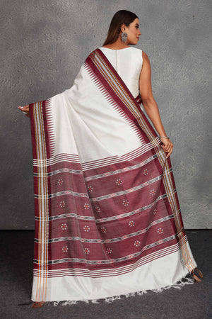Shop elegant white tussar silk saree online in USA with maroon border and pallu. Get festive ready in beautiful Kanchipuram silk saris, pure silk sarees, soft silk sarees, tussar silk saris, handwoven sarees, chanderi silk sarees from Pure Elegance Indian fashion store in USA.-back
