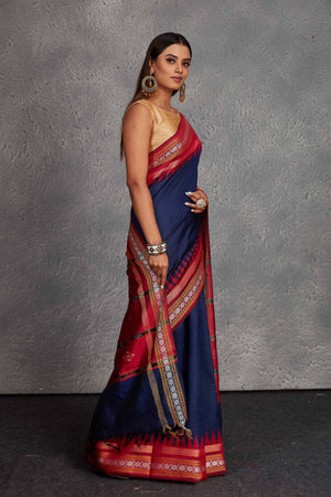 Buy navy blue tussar silk saree online in USA with red temple border and pallu. Get festive ready in beautiful Kanchipuram silk saris, pure silk sarees, soft silk sarees, tussar silk saris, handwoven sarees, chanderi silk sarees from Pure Elegance Indian fashion store in USA.-side
