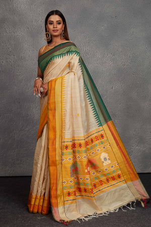 Shop cream tussar silk saree online in USA with green and yellow border. Get festive ready in beautiful Kanchipuram silk saris, pure silk sarees, soft silk sarees, tussar silk saris, handwoven sarees, chanderi silk sarees from Pure Elegance Indian fashion store in USA.-pallu