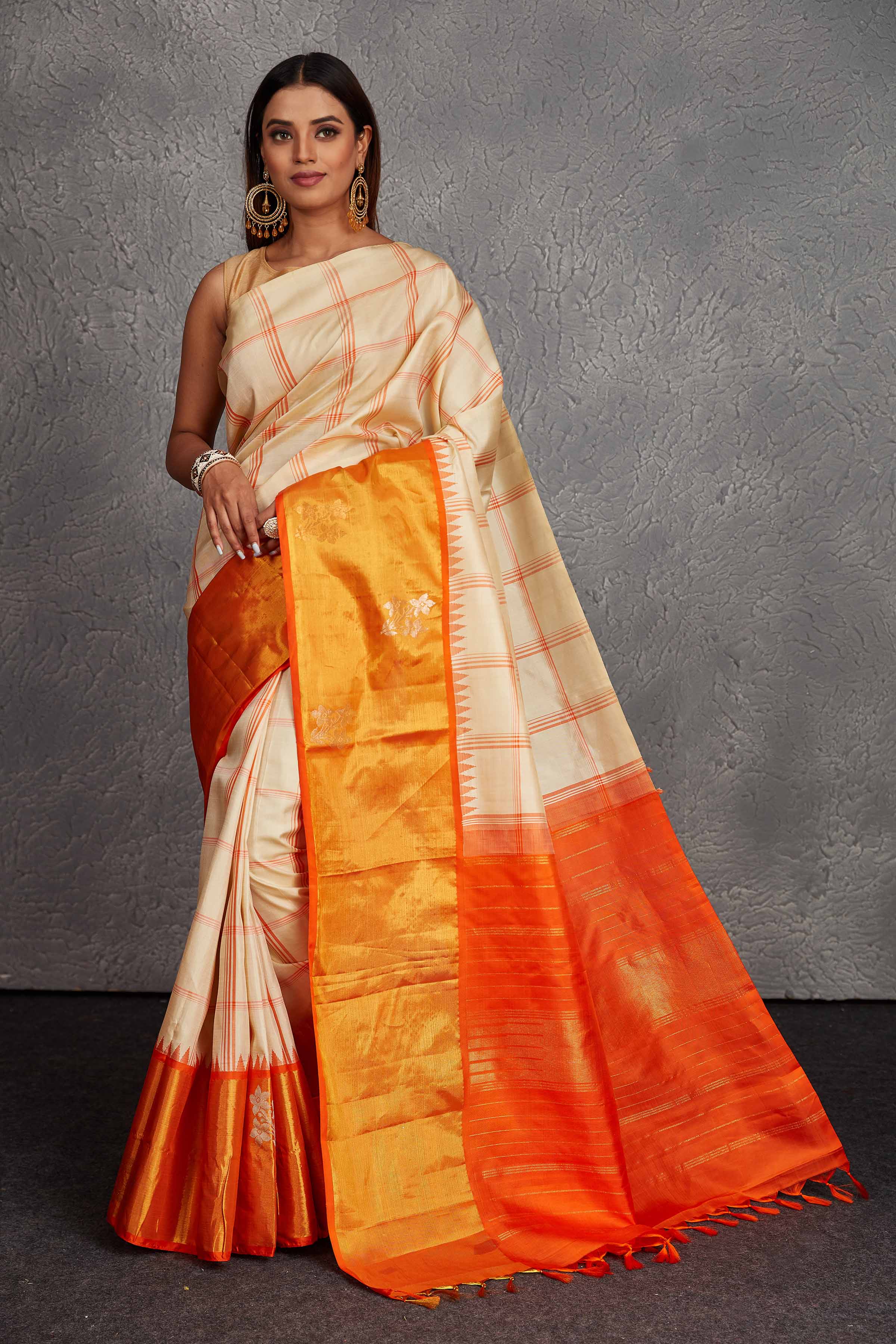 Buy beautiful cream checker Kanchirpuram silk saree online in USA with orange zari border. Get festive ready in beautiful Kanchipuram silk saris, pure silk sarees, soft silk sarees, tussar silk saris, handwoven sarees, chanderi silk sarees from Pure Elegance Indian fashion store in USA.-full view