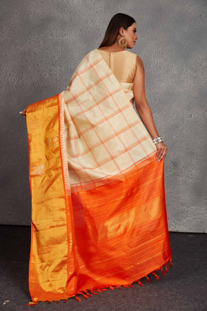 Buy beautiful cream checker Kanchirpuram silk saree online in USA with orange zari border. Get festive ready in beautiful Kanchipuram silk saris, pure silk sarees, soft silk sarees, tussar silk saris, handwoven sarees, chanderi silk sarees from Pure Elegance Indian fashion store in USA.-back