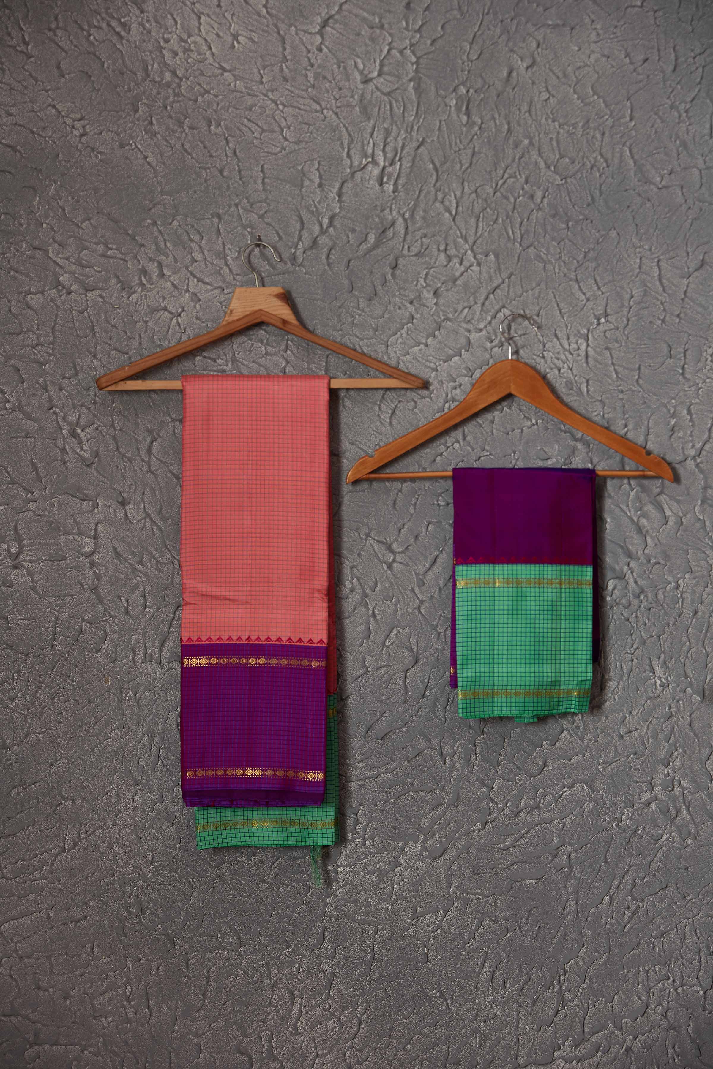 Buy beautiful light pink Kanchirpuram silk sari online in USA with green and purple border. Get festive ready in beautiful Kanchipuram silk saris, pure silk sarees, soft silk sarees, tussar silk saris, handwoven sarees, chanderi silk sarees from Pure Elegance Indian fashion store in USA.-blouse