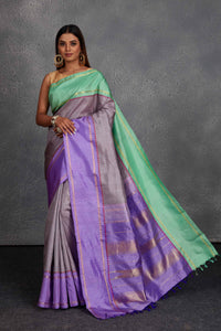 Buy beautiful grey Kanchirpuram silk sari online in USA with lavender and green border. Get festive ready in beautiful Kanchipuram silk saris, pure silk sarees, soft silk sarees, tussar silk saris, handwoven sarees, chanderi silk sarees from Pure Elegance Indian fashion store in USA.-full view