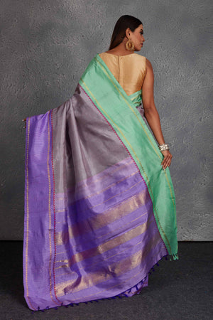 Buy beautiful grey Kanchirpuram silk sari online in USA with lavender and green border. Get festive ready in beautiful Kanchipuram silk saris, pure silk sarees, soft silk sarees, tussar silk saris, handwoven sarees, chanderi silk sarees from Pure Elegance Indian fashion store in USA.-back